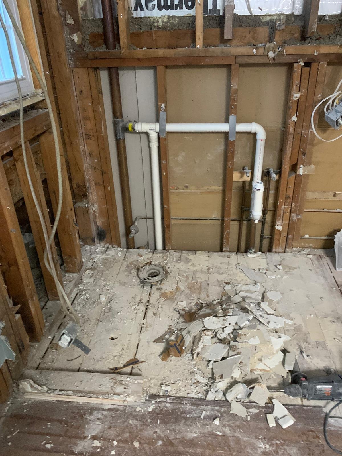 Bathroom opened to framing during reconstruction in Boxford Massachusetts