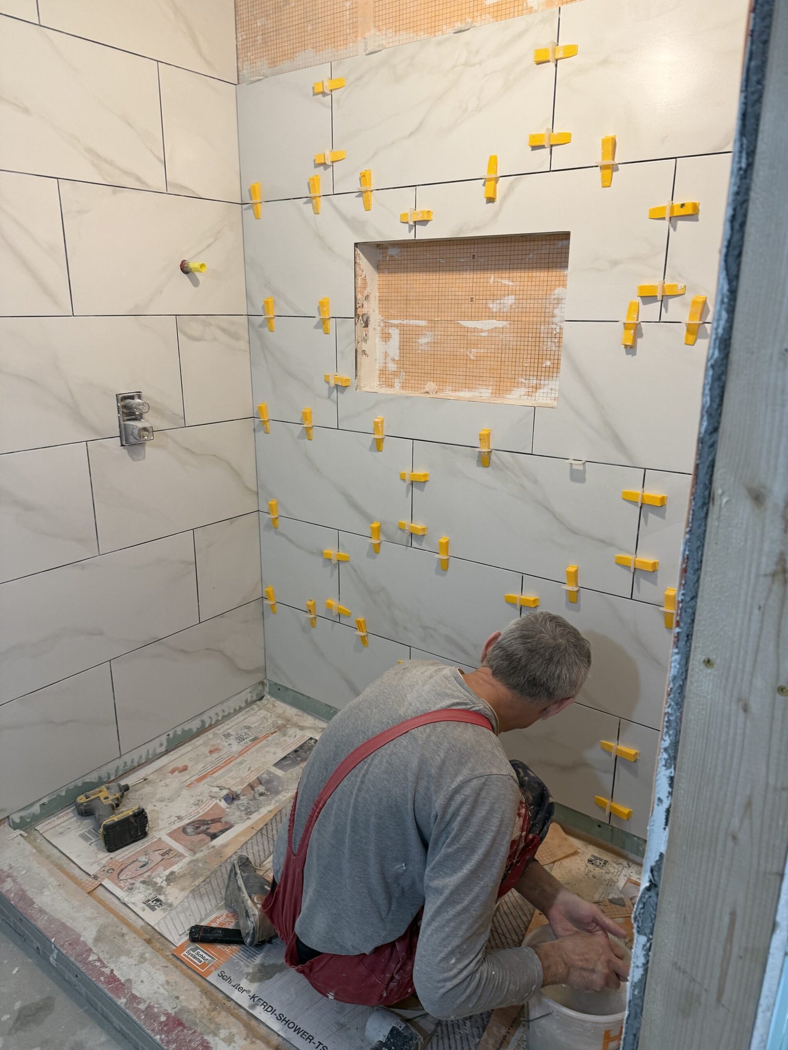 Large-format shower tile installation in progress in Boxford Massachusetts
