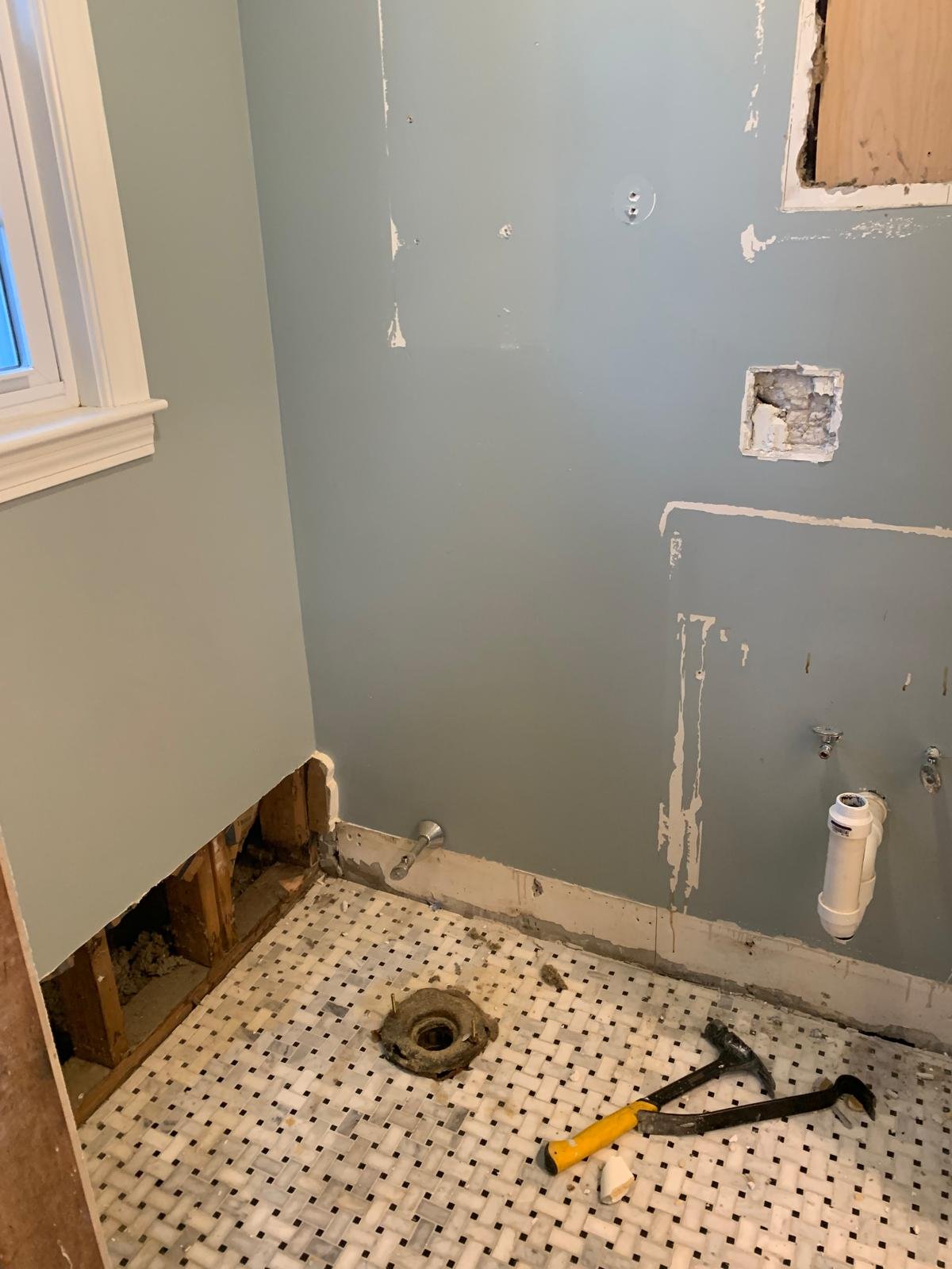 Mosaic shower floor and drain installation in progress in Boxford Massachusetts