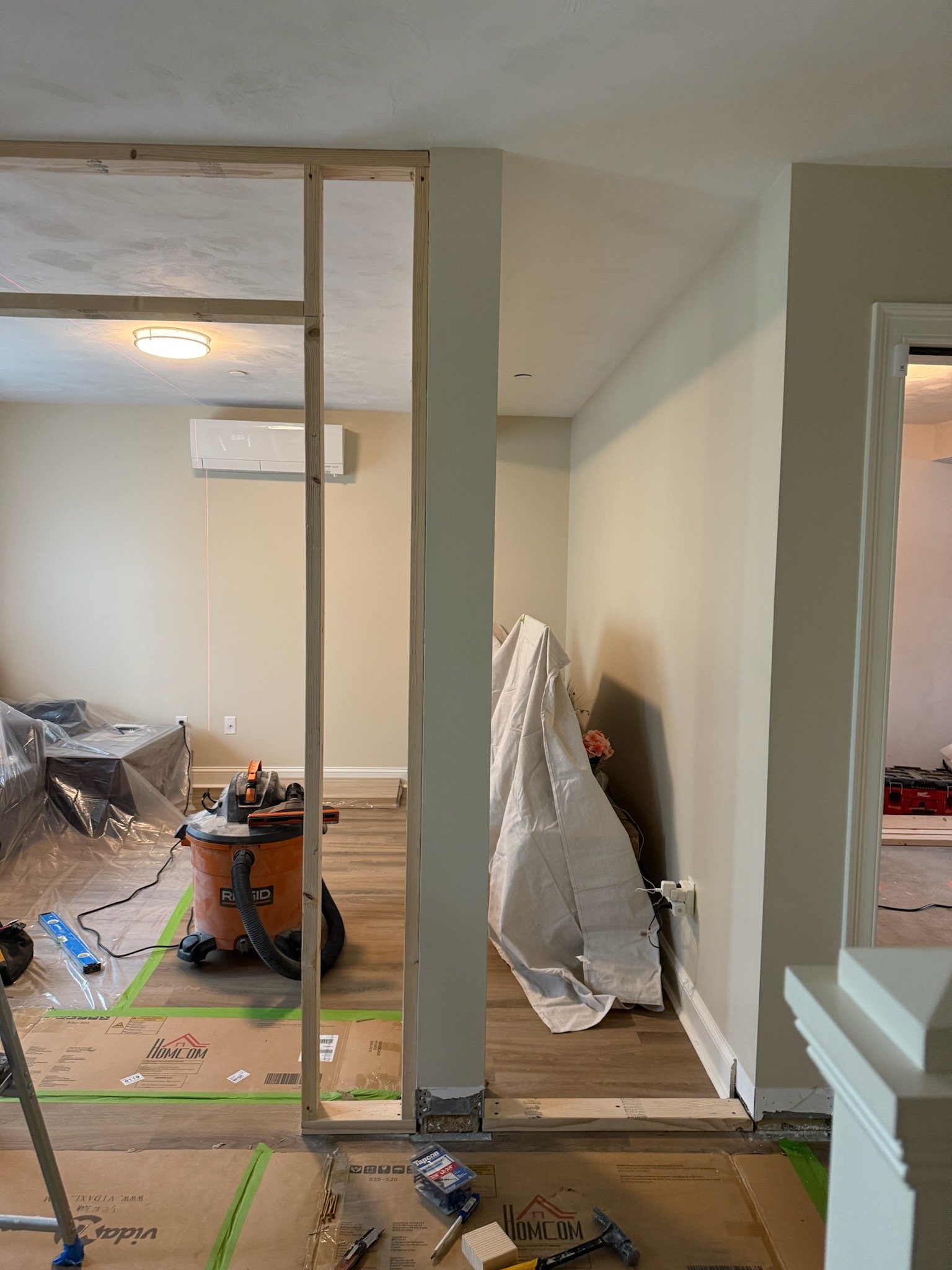 Second view of the framed hallway and two-room layout in Bridgewater Massachusetts