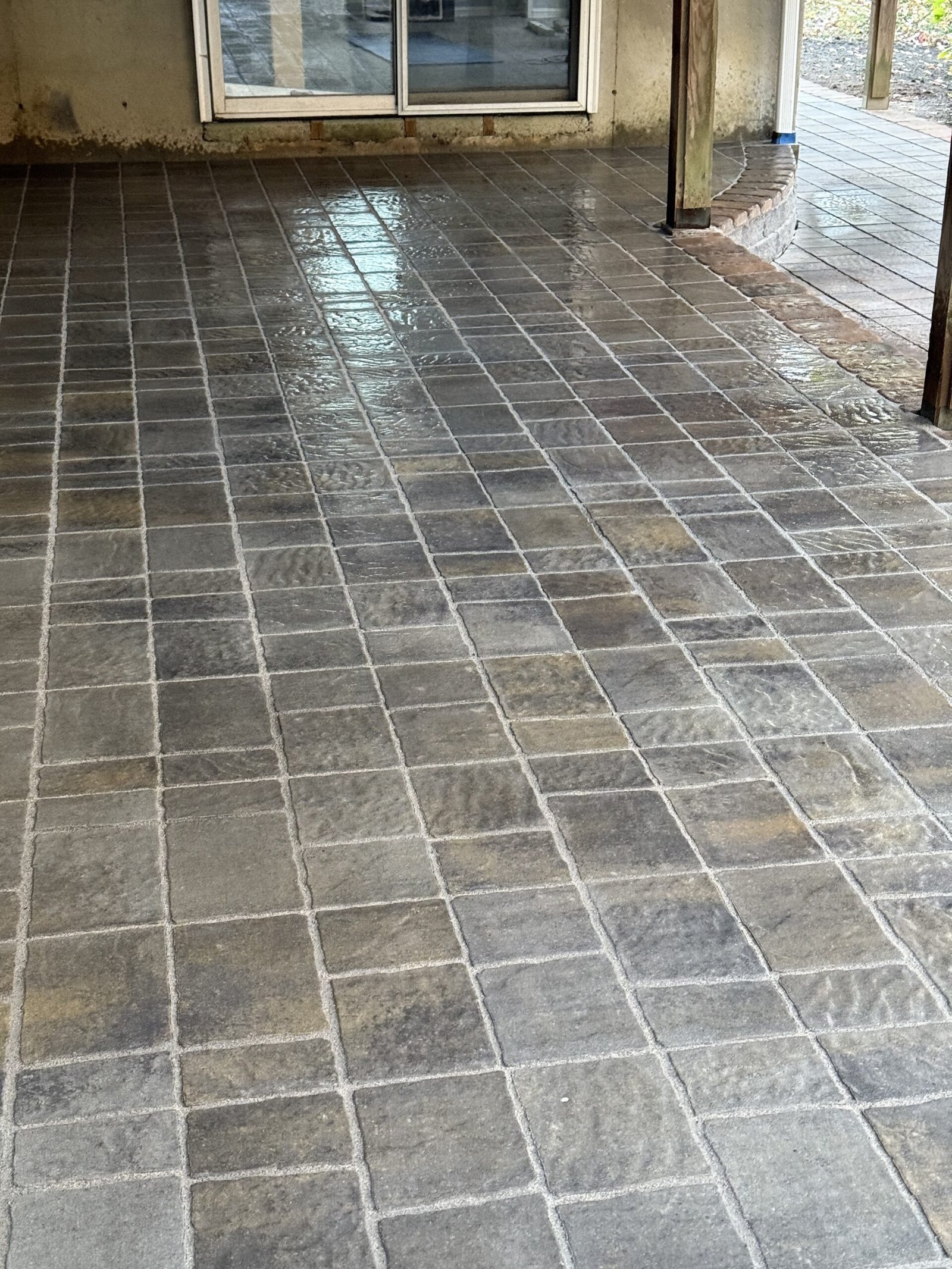 Finished paver patio in Dover Massachusetts viewed toward the house