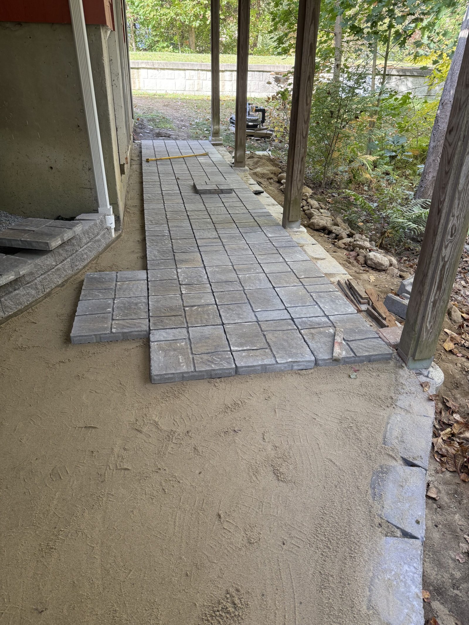 Patio and walkway pavers extending through the work area in Dover Massachusetts
