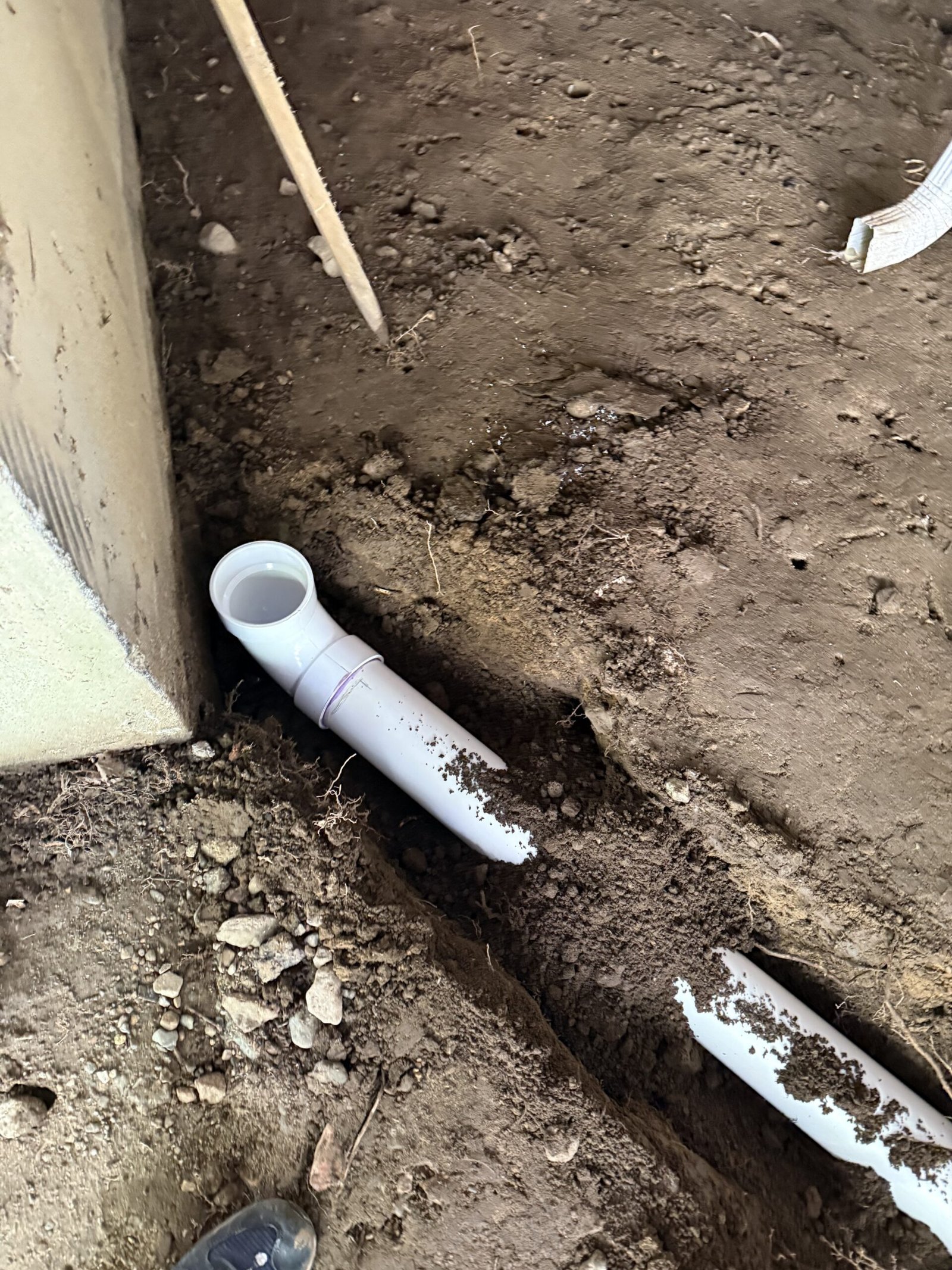 Close view of drainage piping and trench work in Dover Massachusetts