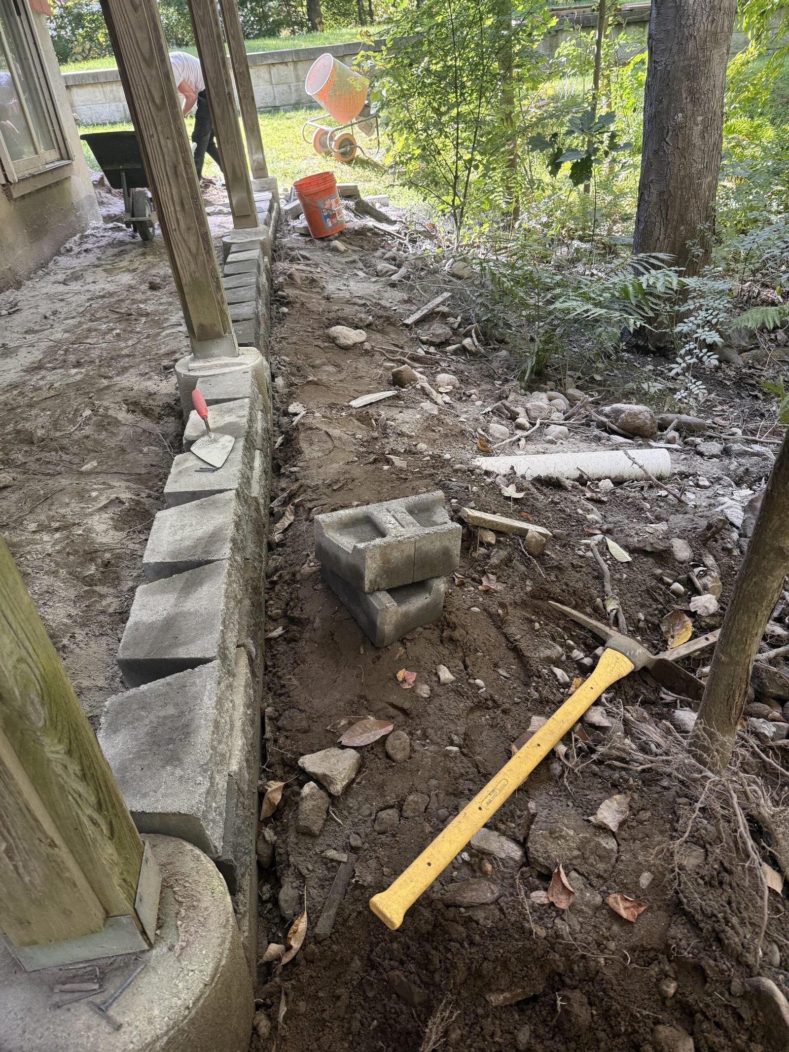Outdoor edge wall and hardscape border under construction in Dover Massachusetts