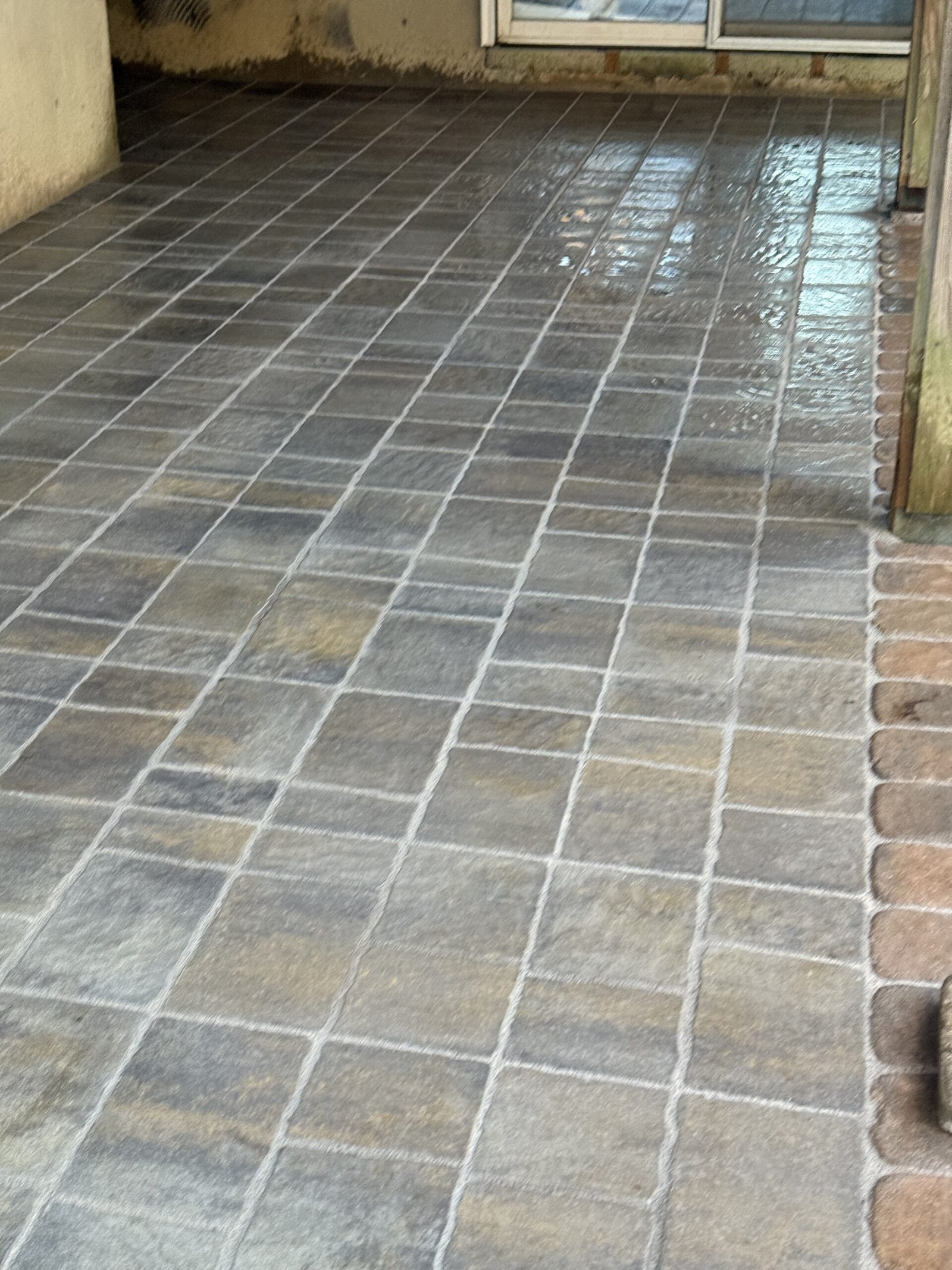 Wide finished patio surface with straight paver layout in Dover Massachusetts