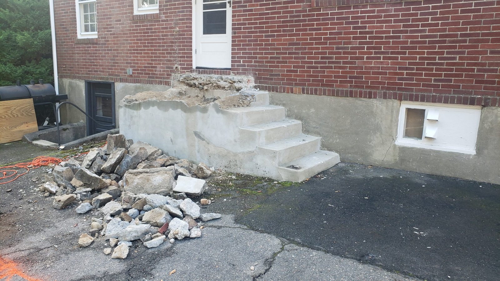 Existing concrete steps removed and deck construction site cleared in Marblehead Massachusetts