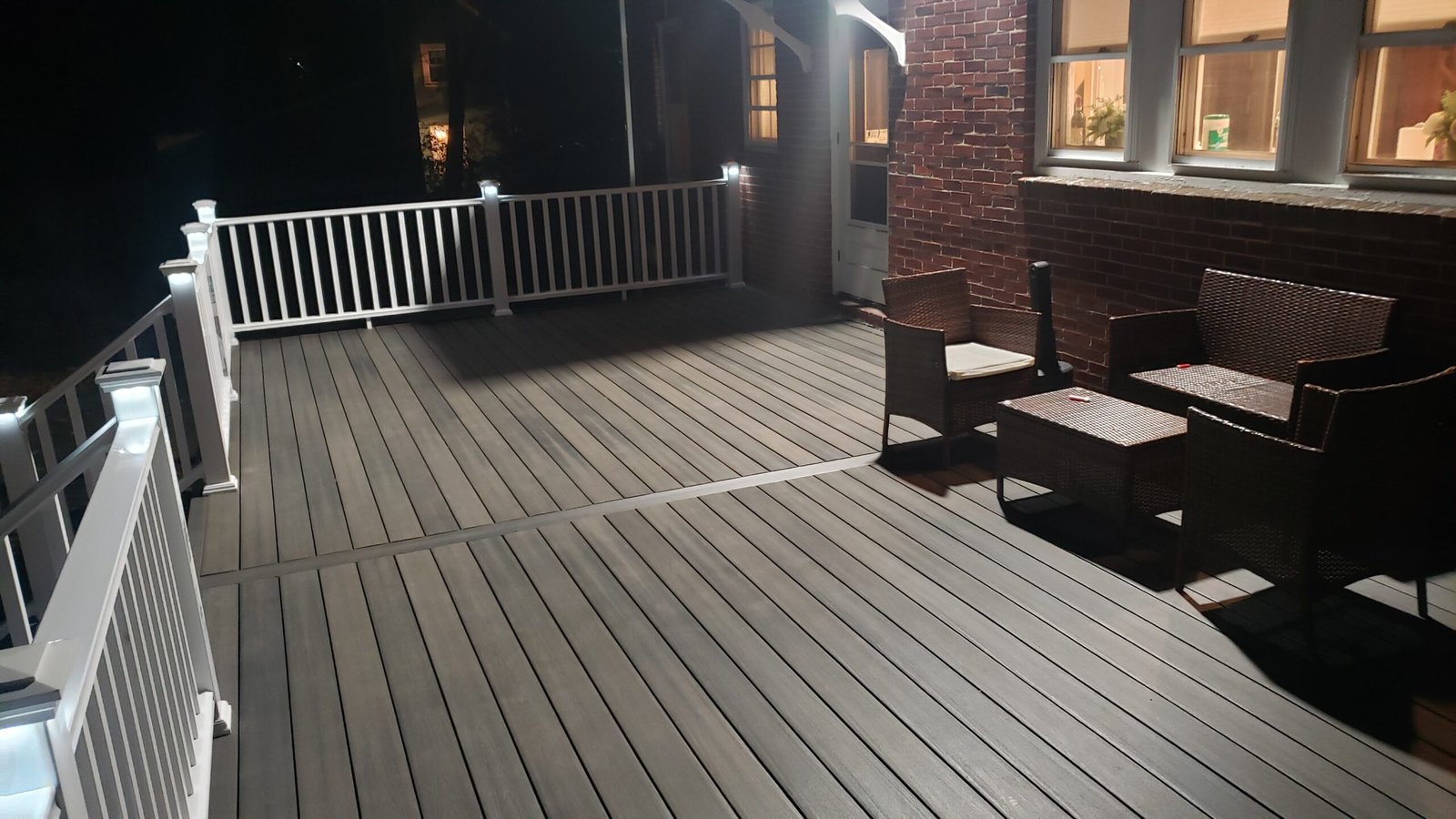 Completed Marblehead deck surface white railing system posts and finished edges