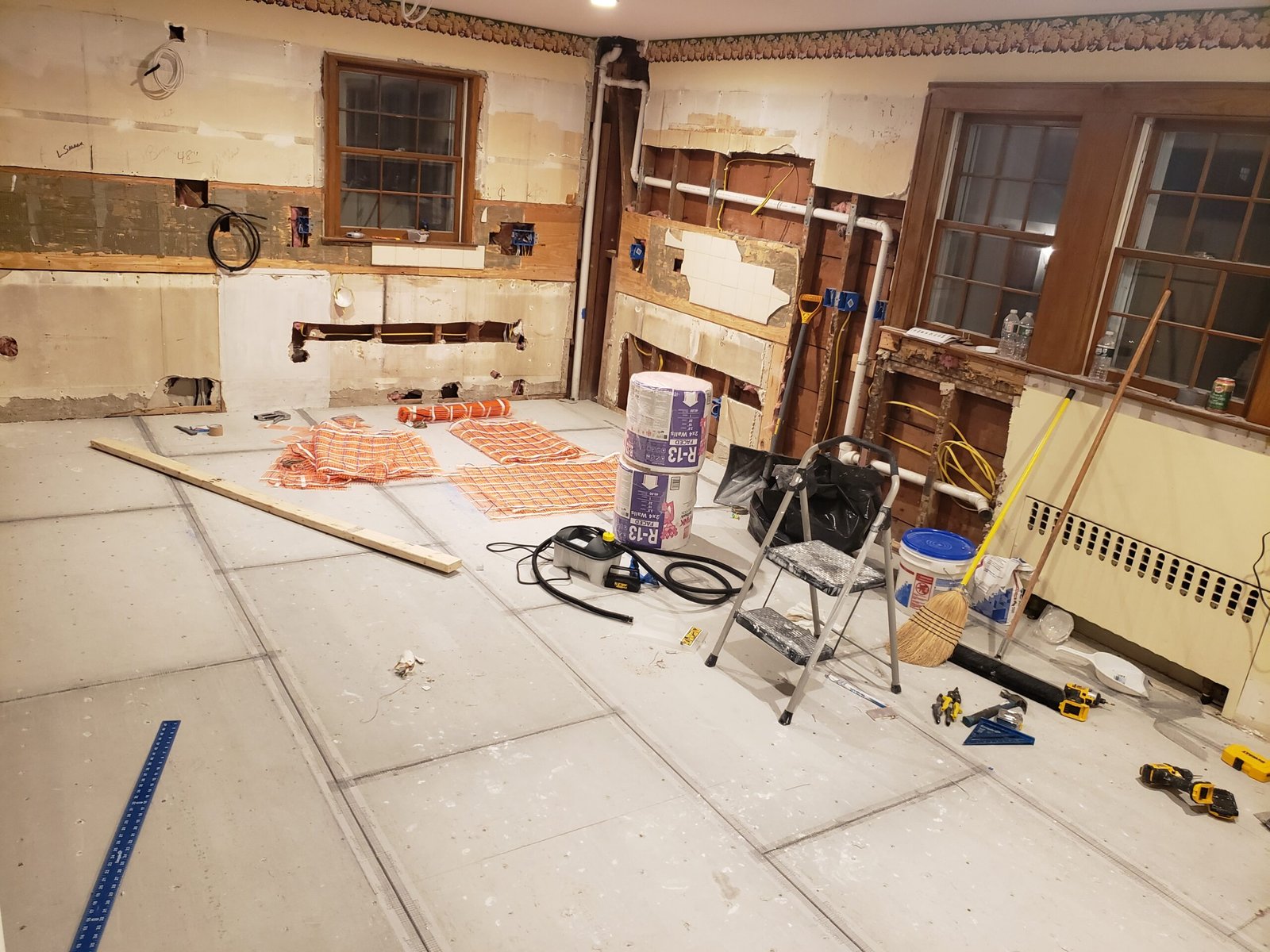 Kitchen floor and surrounding surfaces being prepared before cabinetry installation in Marblehead Massachusetts
