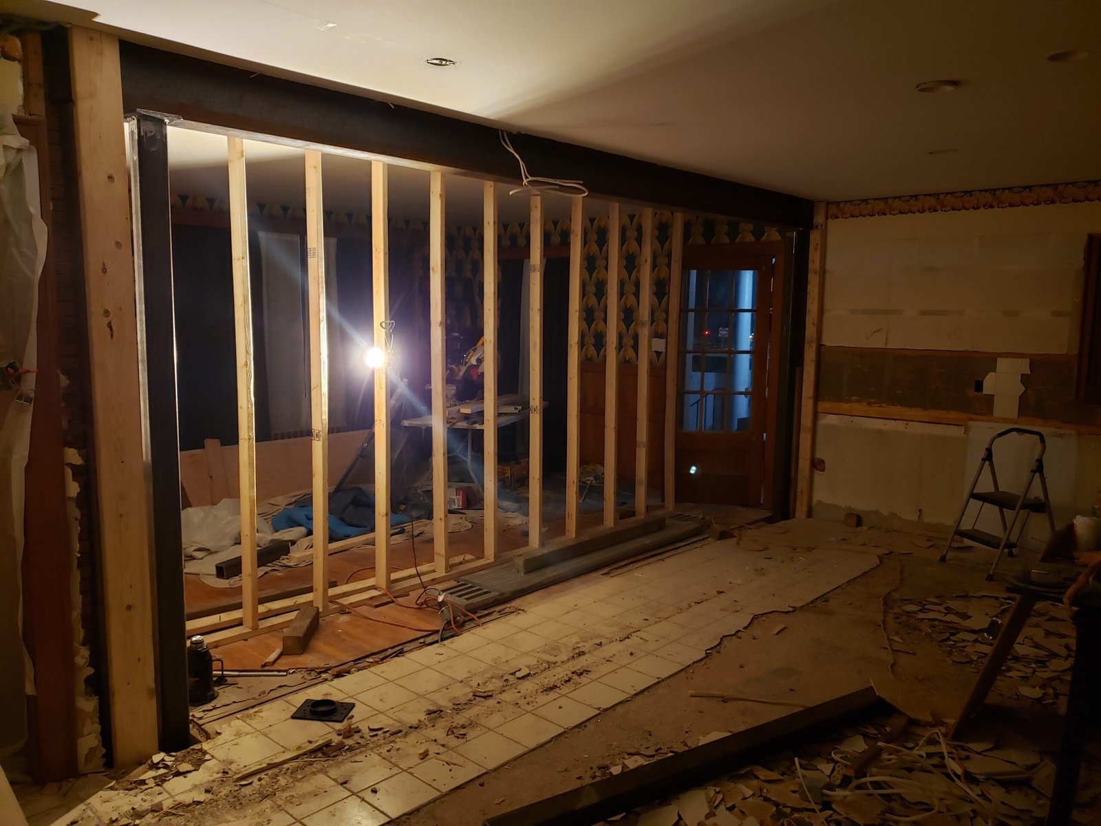Wall framing exposed during removal of the wall between a Marblehead kitchen and dining room