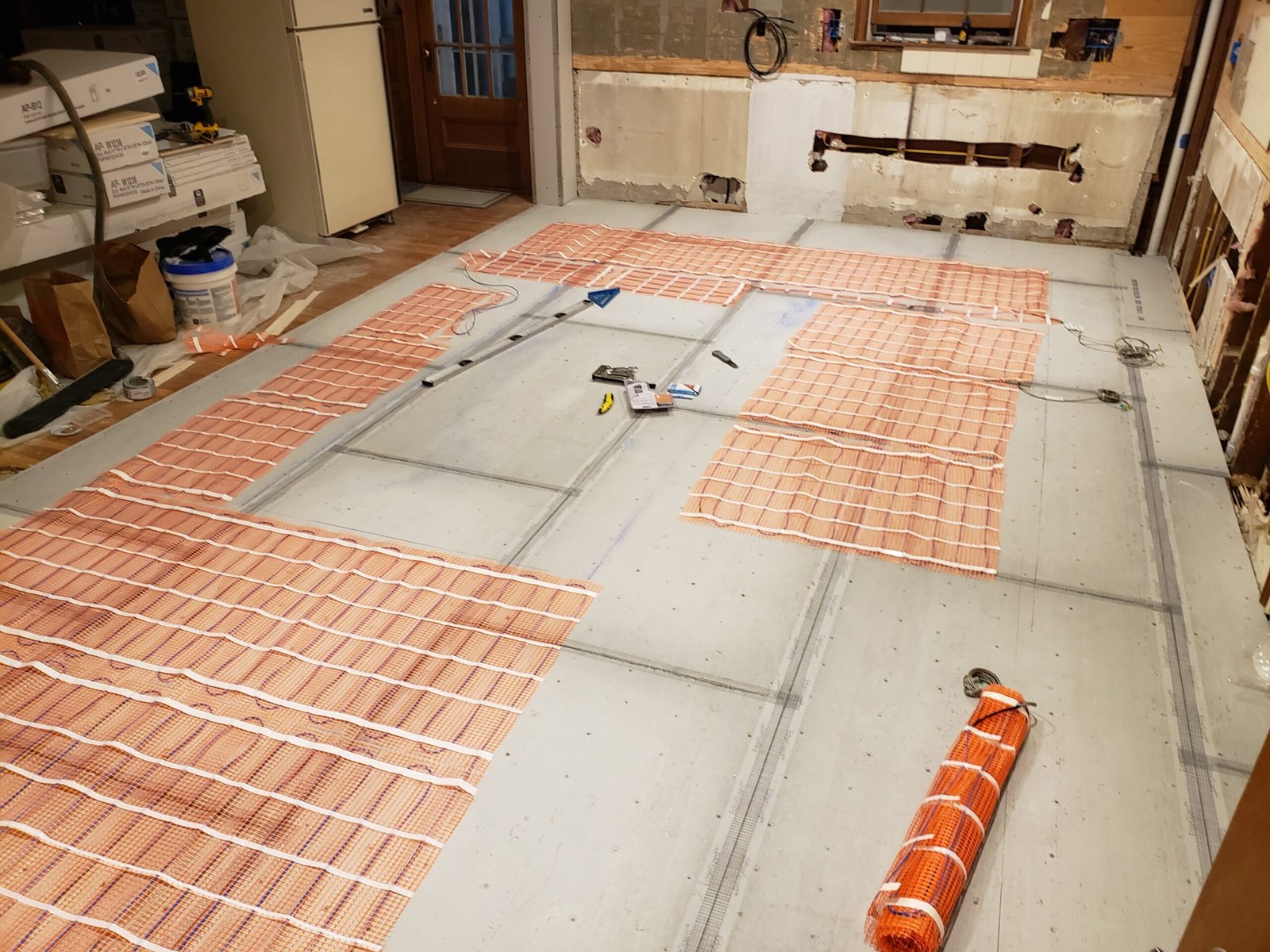 Electric radiant floor heating mats installed during a Marblehead kitchen renovation