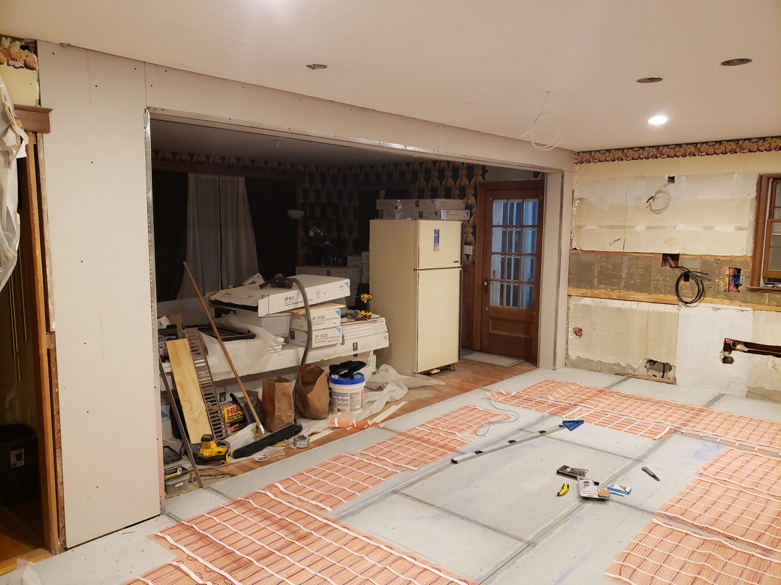 Radiant floor heating and underlayment continuing through the remodeled Marblehead kitchen