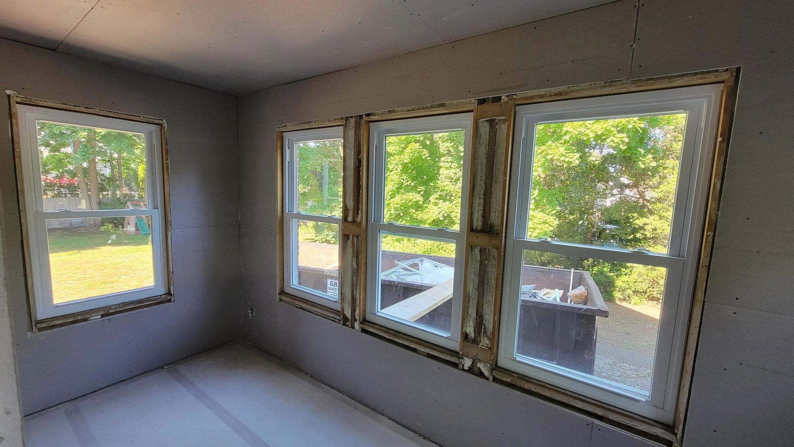 Wide view of the office after drywall installation and window replacement in Marblehead Massachusetts