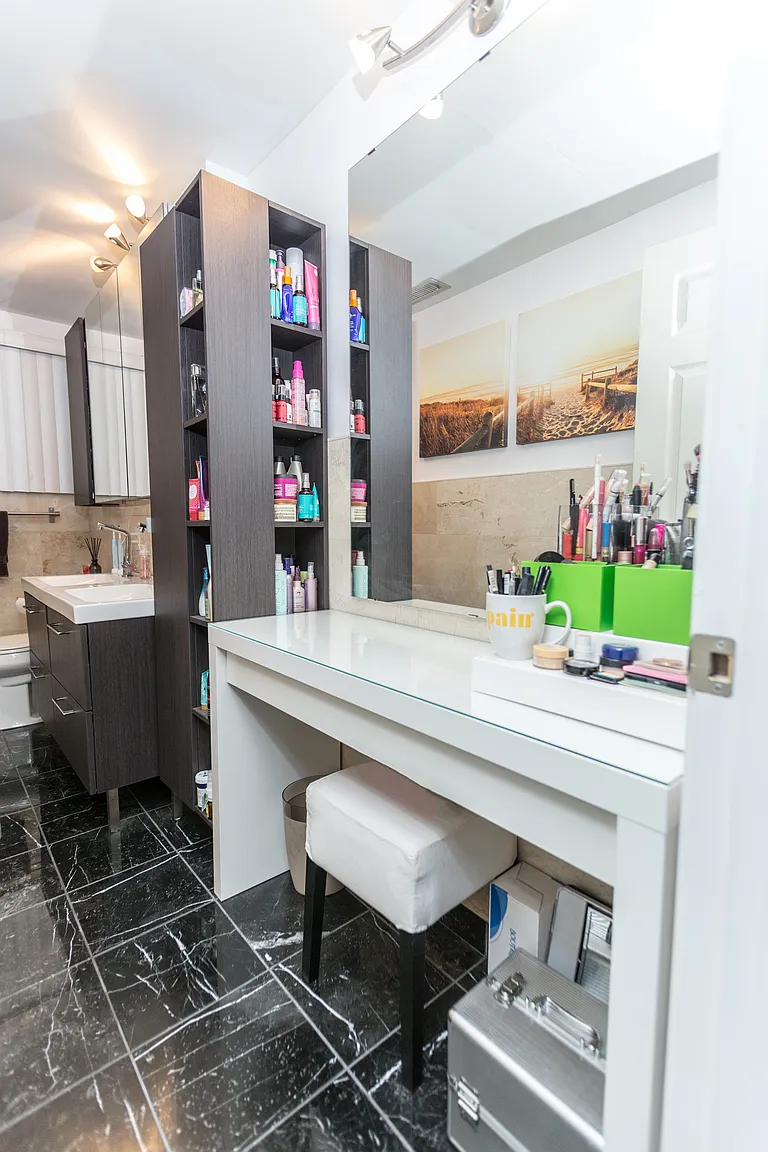 Professionally staged finished bathroom with dark tile vanity mirror and bathtub in Saugus Massachusetts