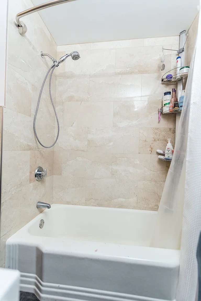 Completed tiled bathtub and shower in a Saugus whole-house renovation