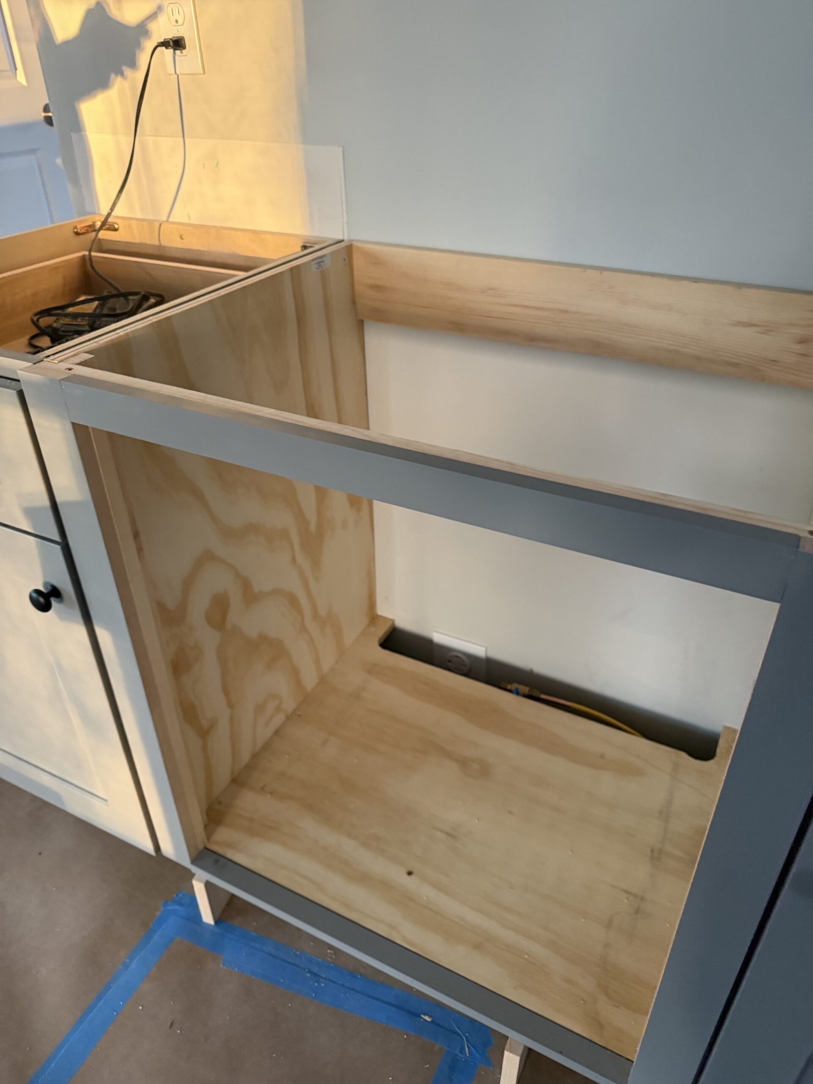 Custom plywood cabinet structure built for a wall oven and cooktop in an Uxbridge Massachusetts kitchen