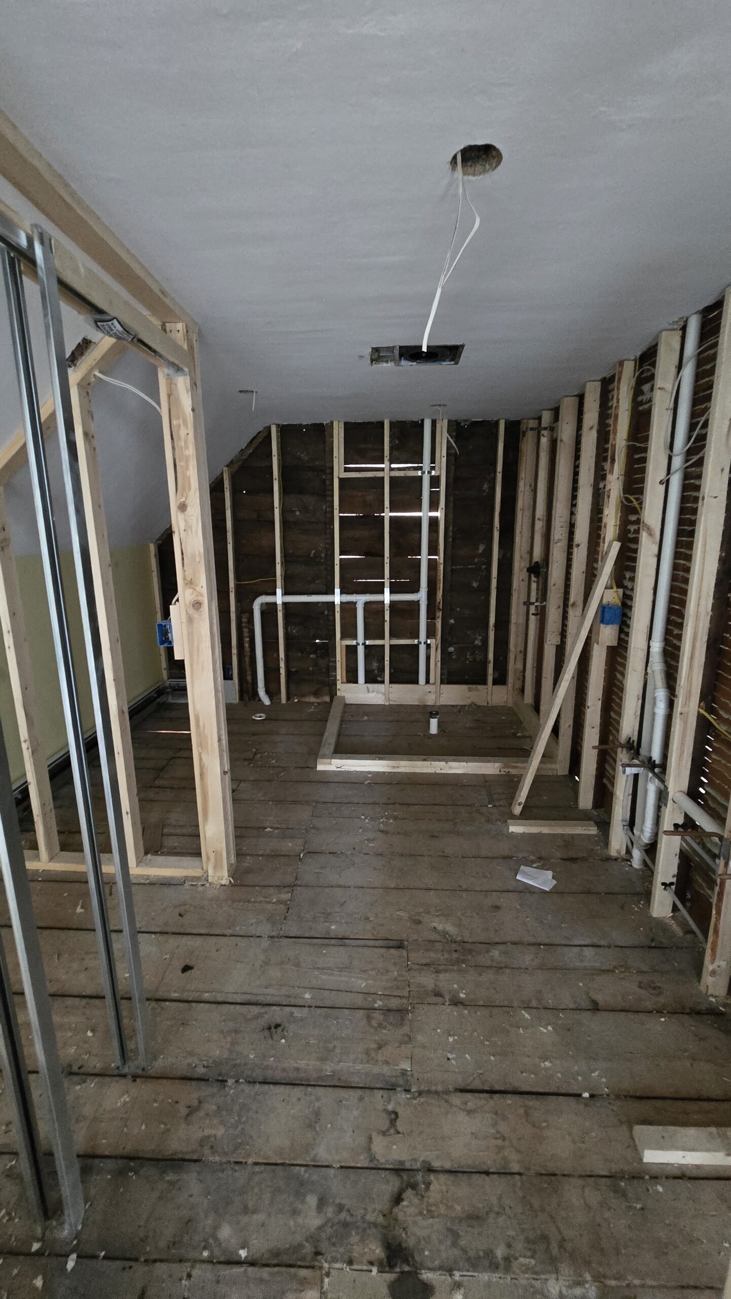 Condition when New England Renovation Pros took over the partially demolished Wayland home