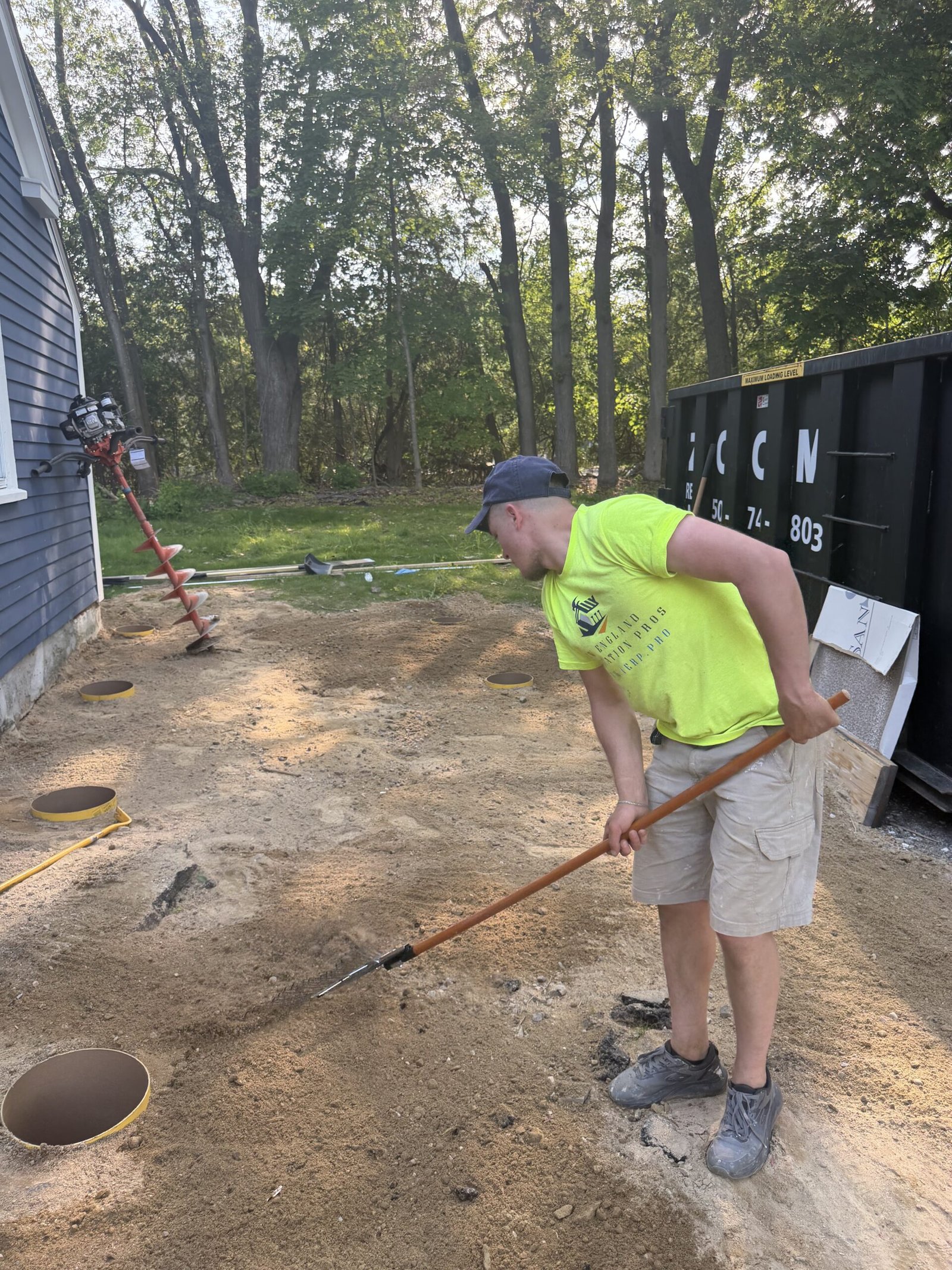Deck layout drilling and post-hole work in Wayland Massachusetts, photograph 2