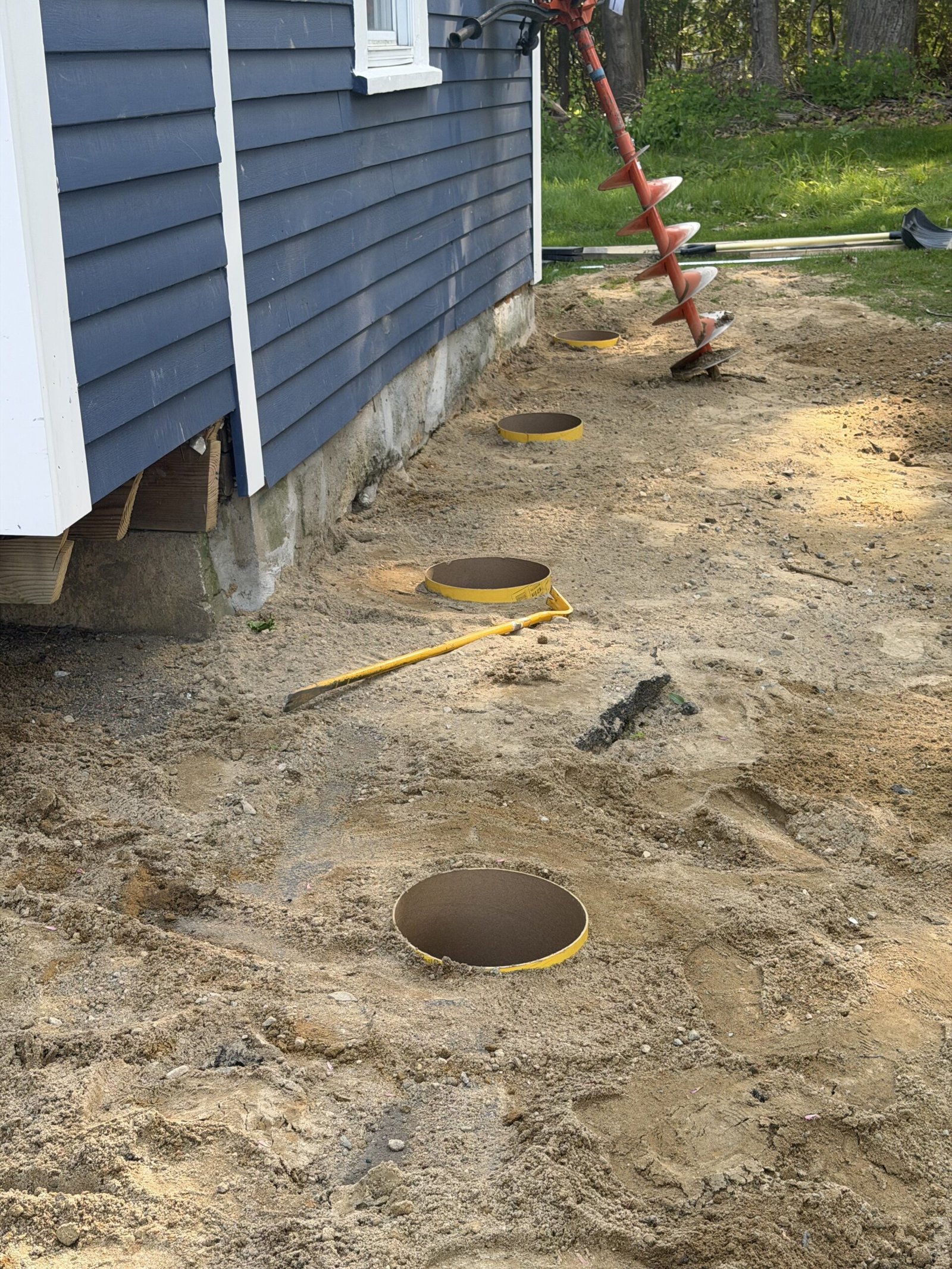 Deck layout drilling and post-hole work in Wayland Massachusetts, photograph 3