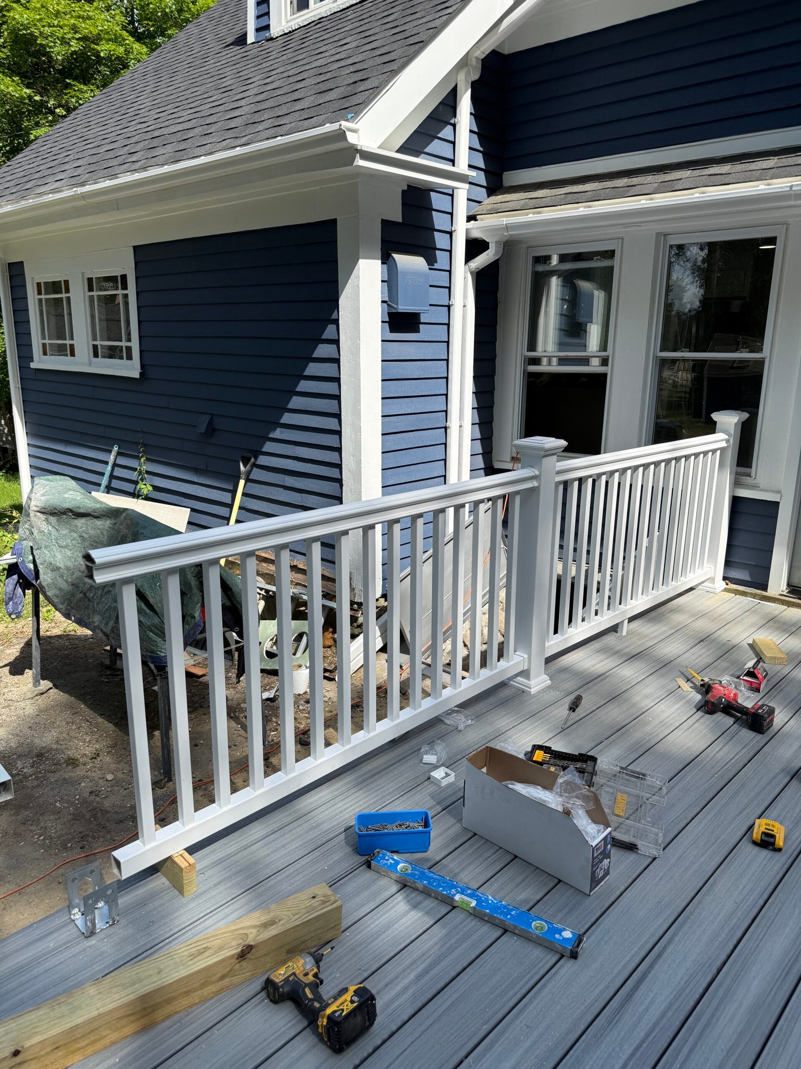 Railing installation during a deck construction project in Wayland Massachusetts, photograph 2