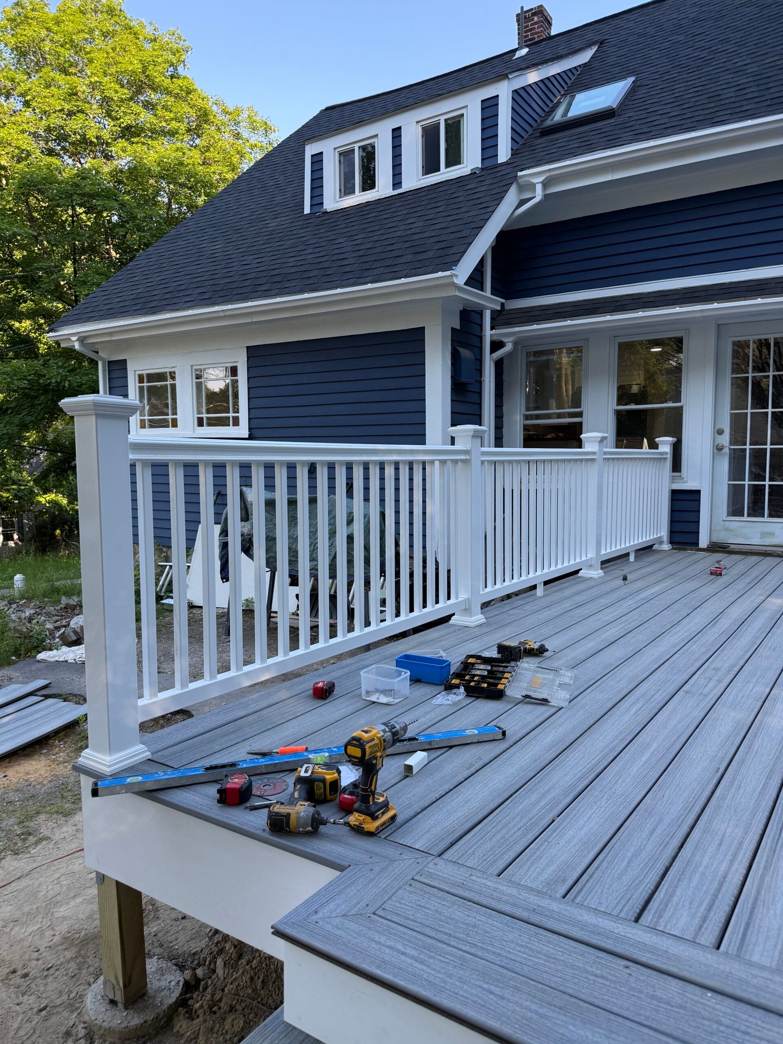 Railing installation during a deck construction project in Wayland Massachusetts, photograph 3