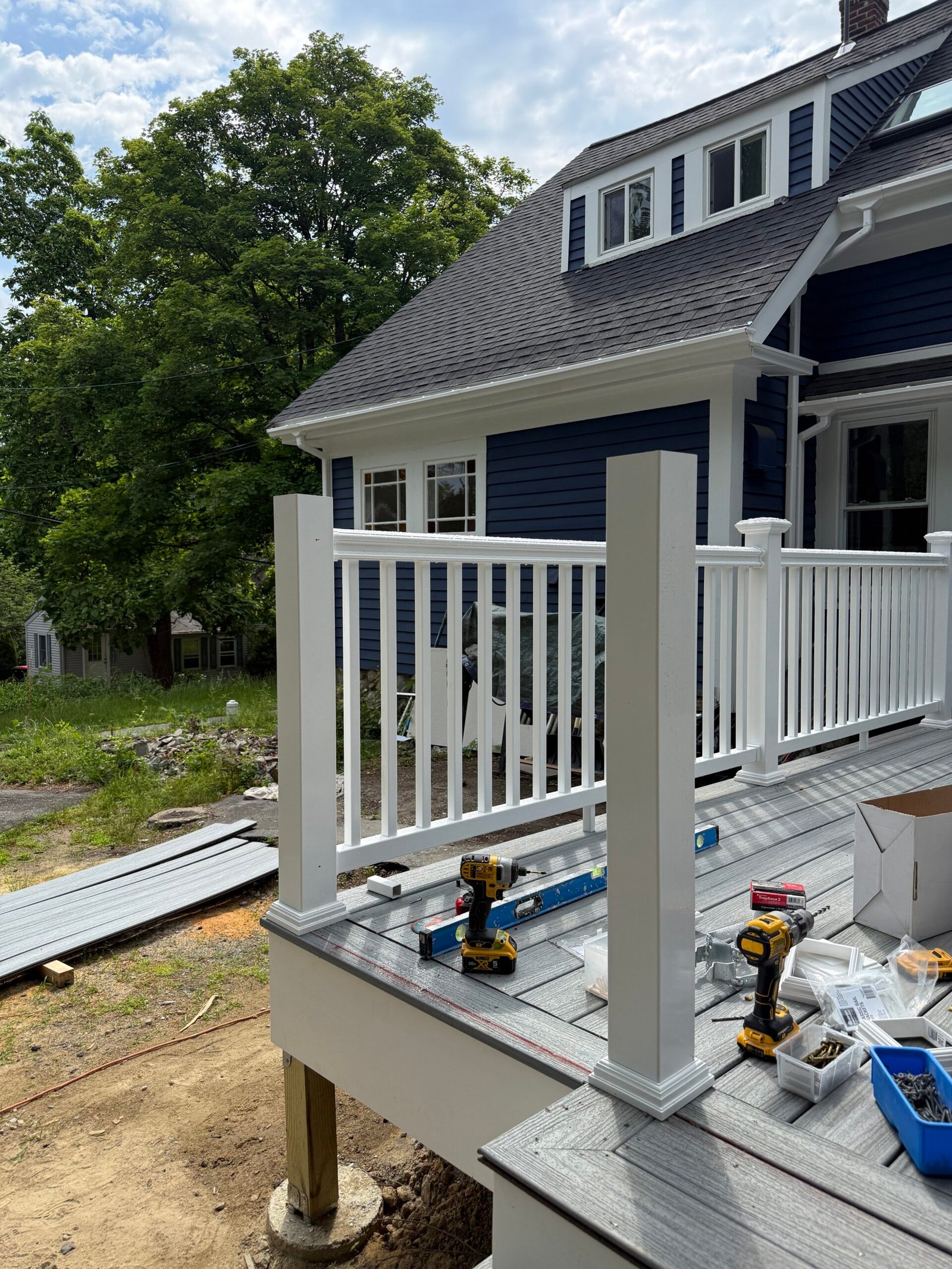 Railing installation during a deck construction project in Wayland Massachusetts, photograph 5