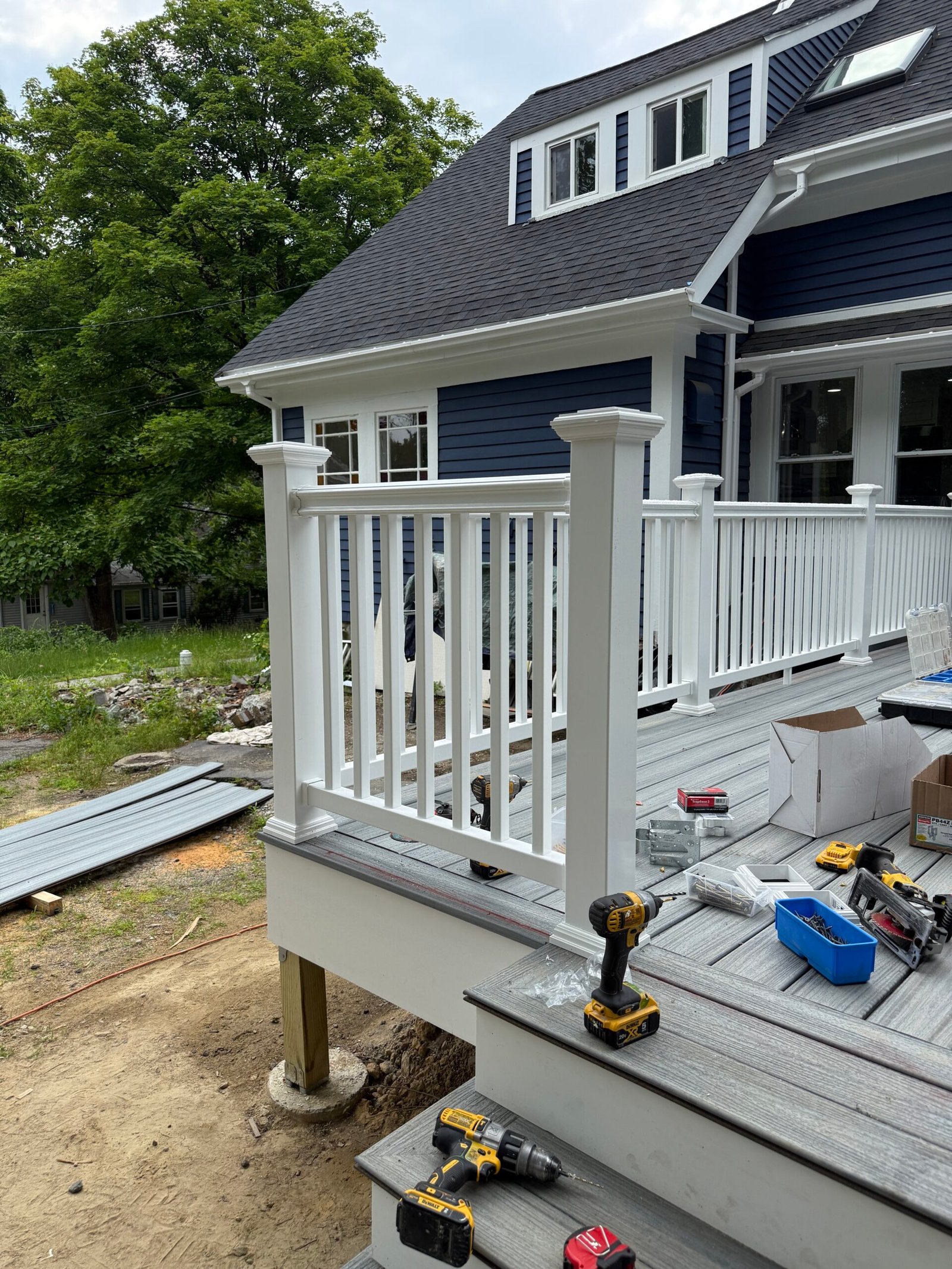 Railing installation during a deck construction project in Wayland Massachusetts, photograph 6