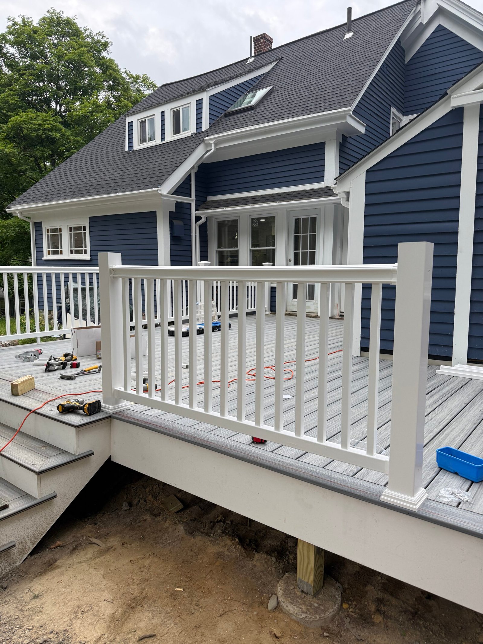 Railing installation during a deck construction project in Wayland Massachusetts, photograph 8