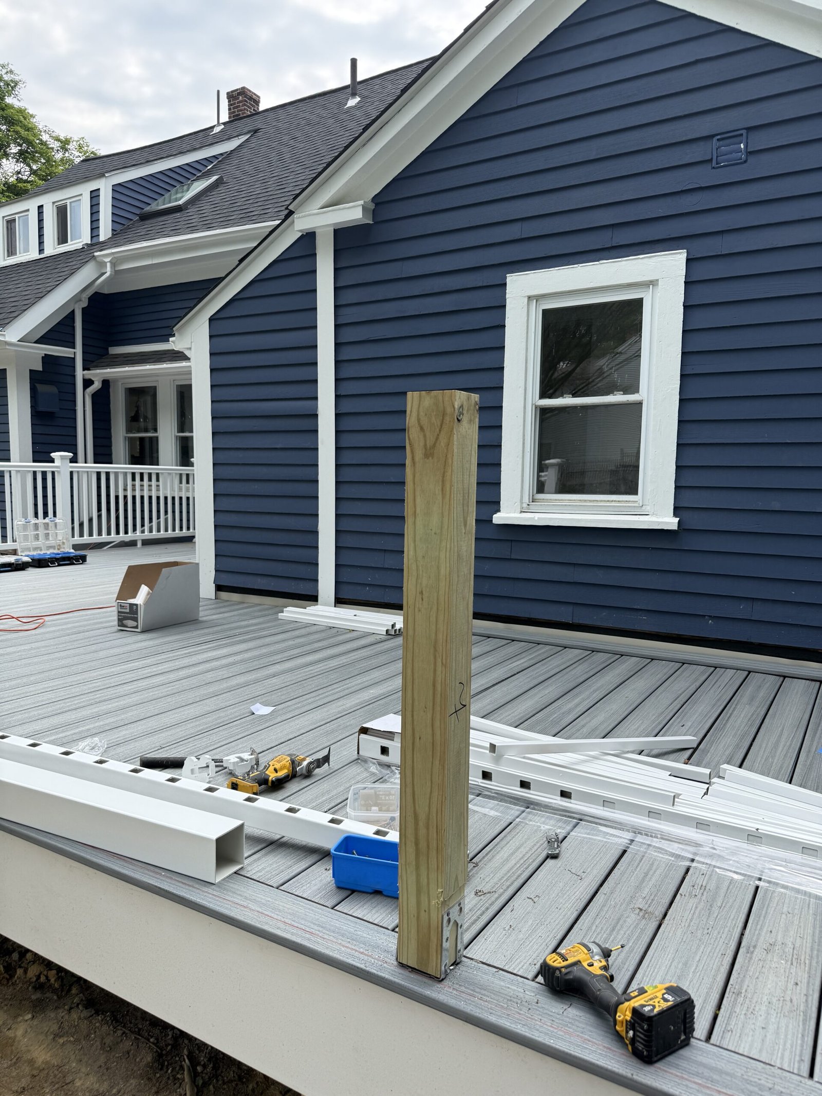 Railing installation during a deck construction project in Wayland Massachusetts, photograph 9