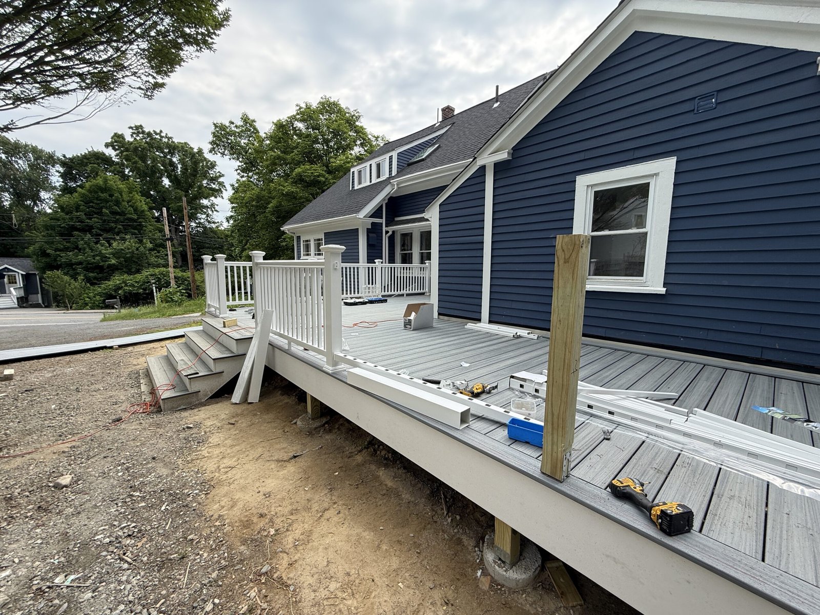 Railing installation during a deck construction project in Wayland Massachusetts, photograph 10