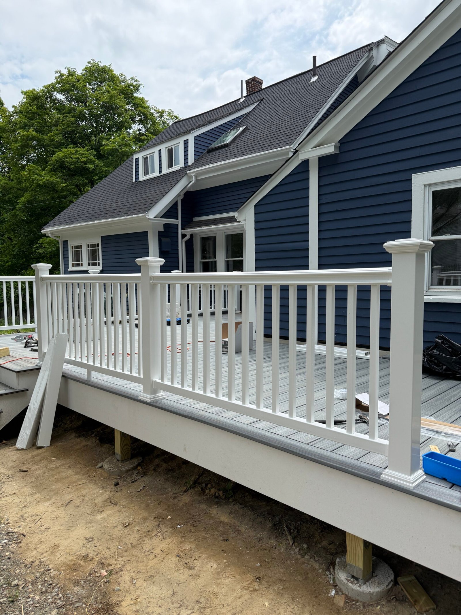 Railing installation during a deck construction project in Wayland Massachusetts, photograph 11