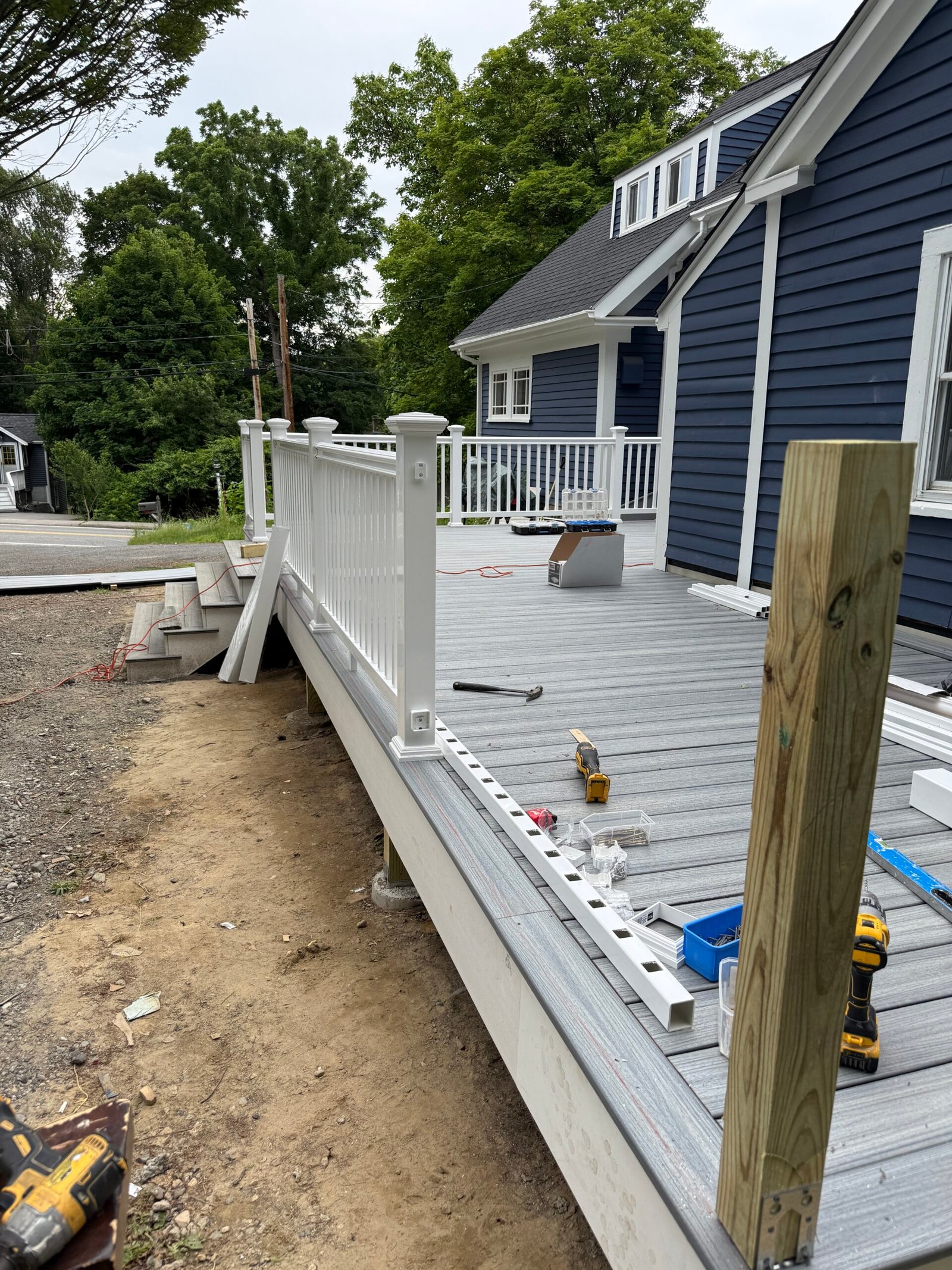 Railing installation during a deck construction project in Wayland Massachusetts, photograph 12