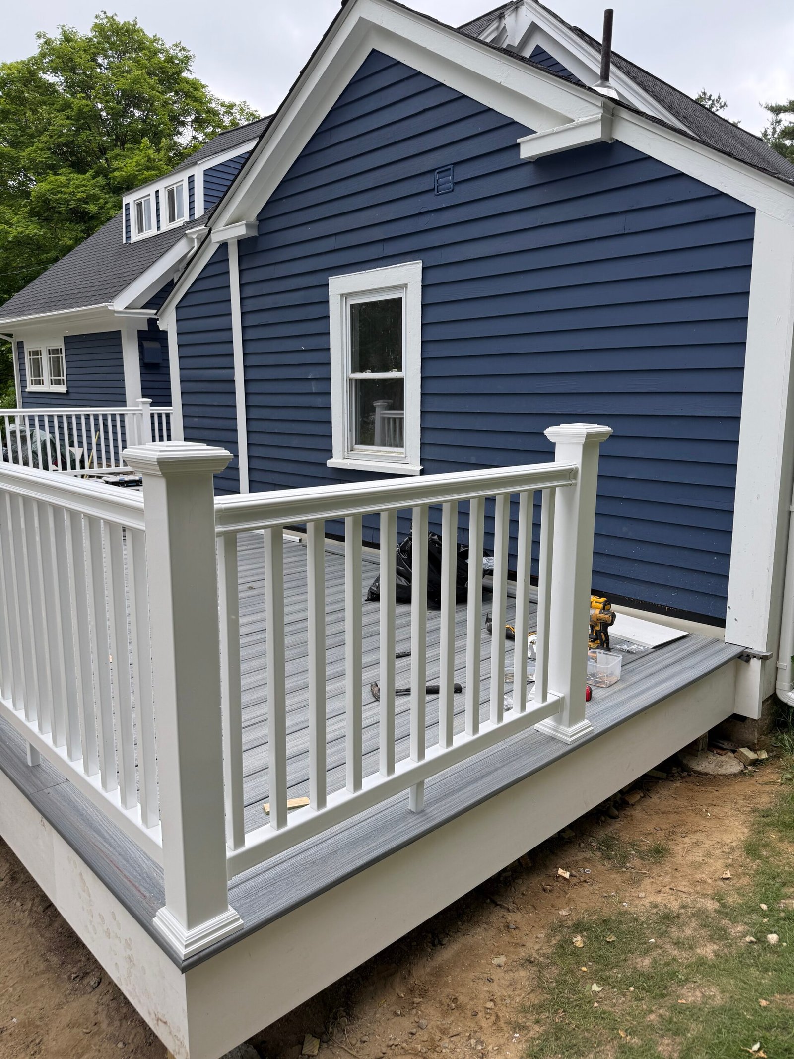 Railing installation during a deck construction project in Wayland Massachusetts, photograph 14