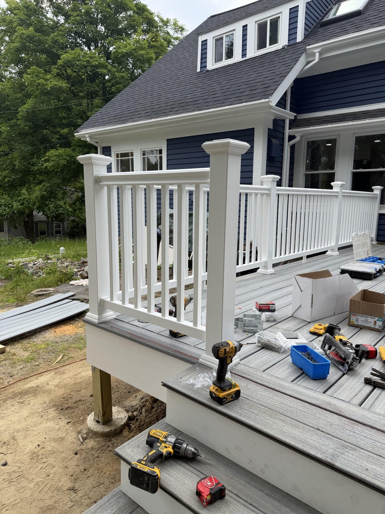 Completed deck with railings and stairs after deck construction in Wayland Massachusetts