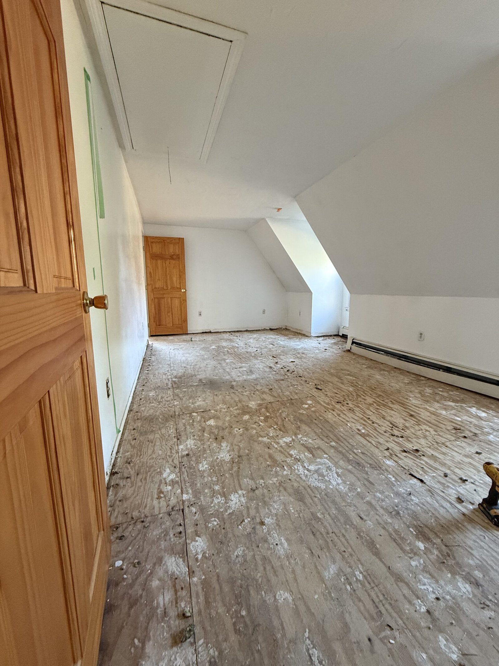 Old flooring removal and substrate preparation during whole-house renovation in Wayland Massachusetts, photograph 1