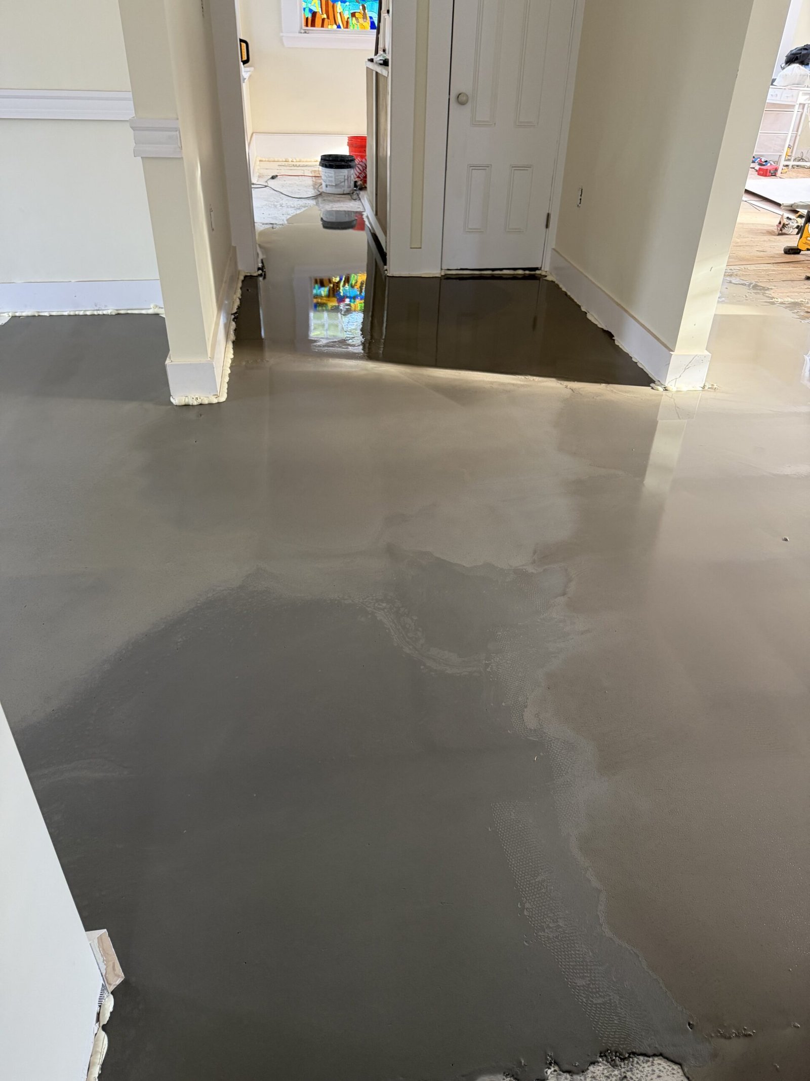 Self-leveling compound and final floor preparation during whole-house renovation in Wayland Massachusetts, photograph 2