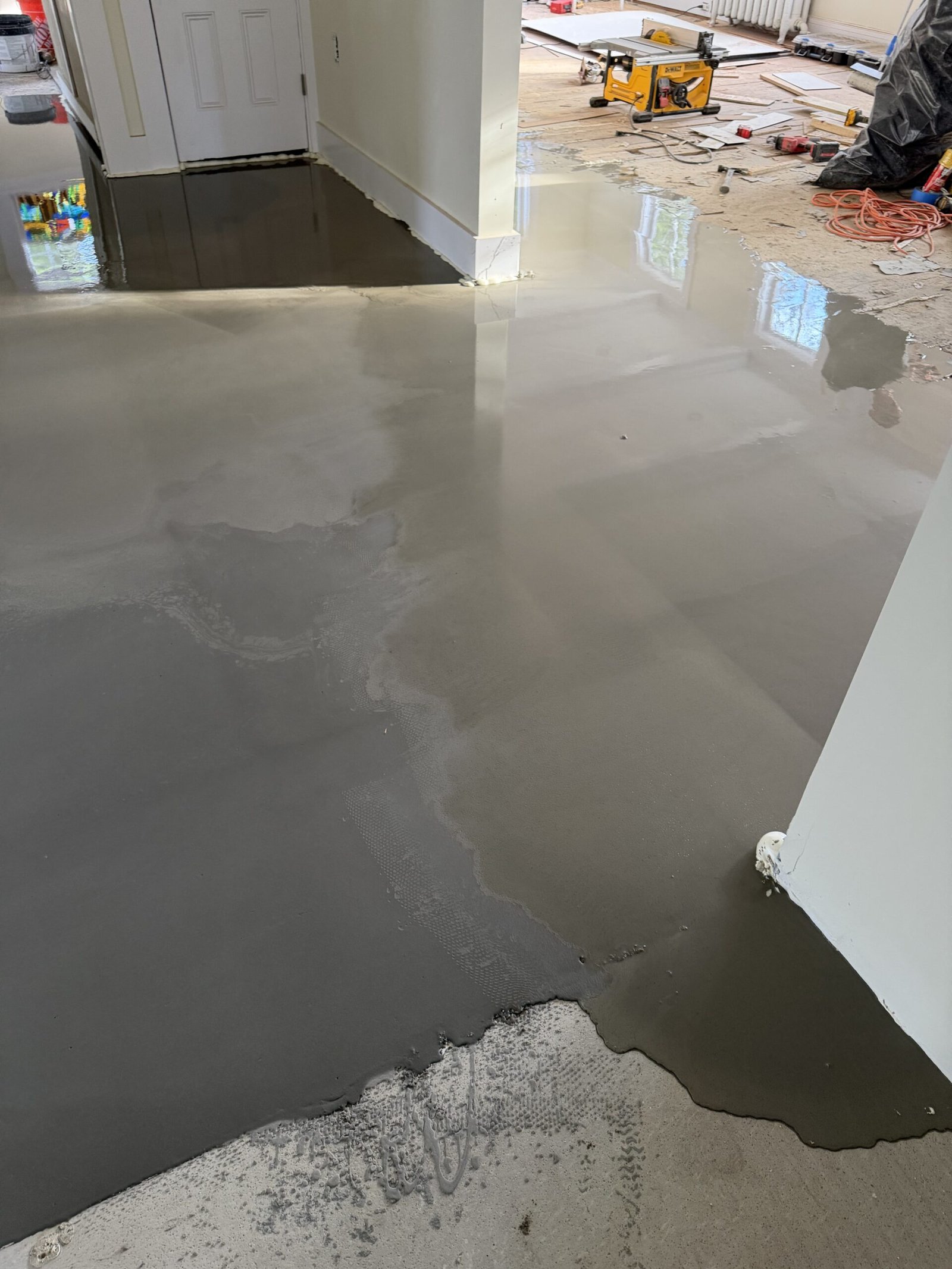Self-leveling compound and final floor preparation during whole-house renovation in Wayland Massachusetts, photograph 3