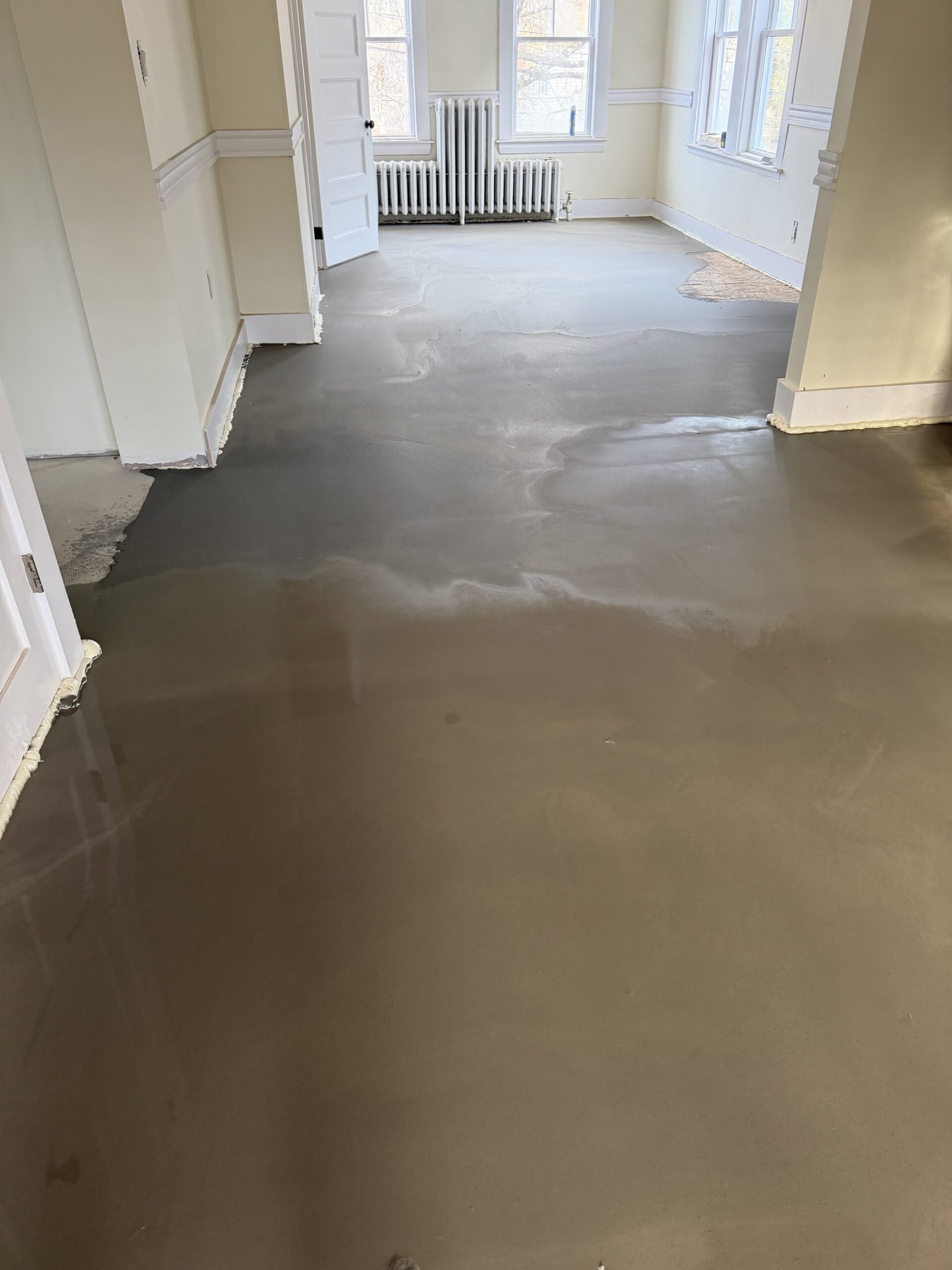 Self-leveling compound and final floor preparation during whole-house renovation in Wayland Massachusetts, photograph 4