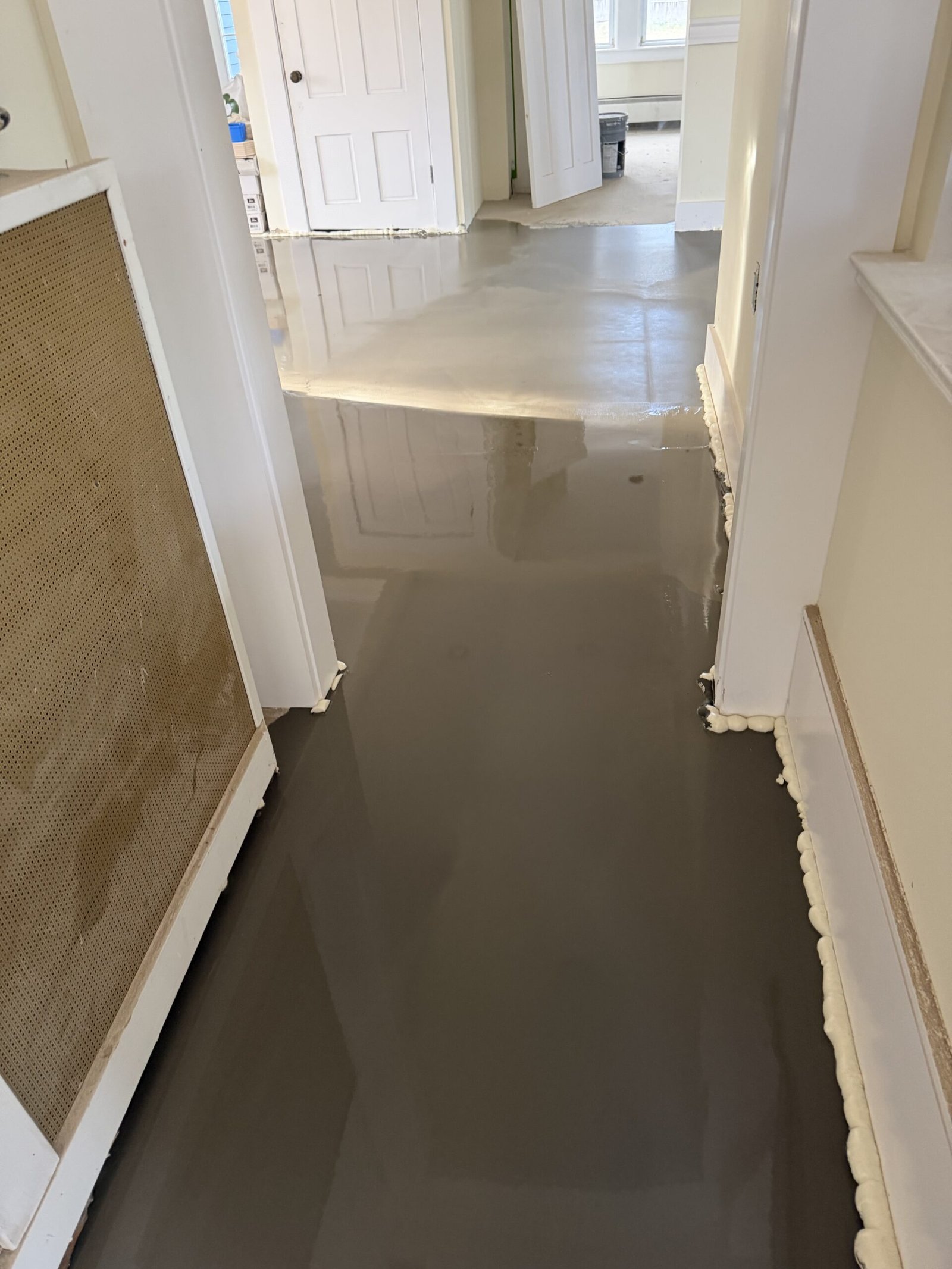Self-leveling compound and final floor preparation during whole-house renovation in Wayland Massachusetts, photograph 7