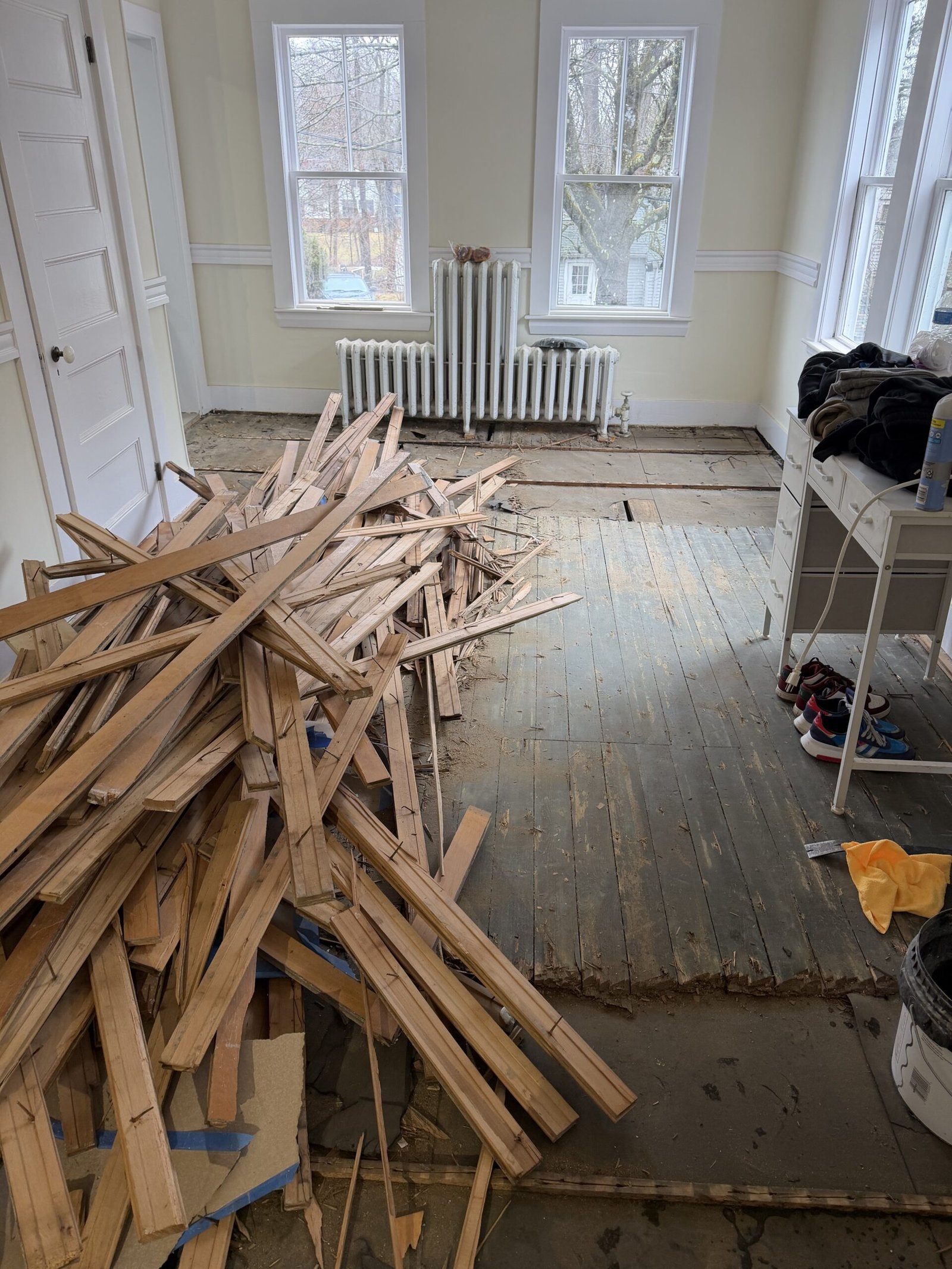 Old flooring removal and substrate preparation during whole-house renovation in Wayland Massachusetts, photograph 2