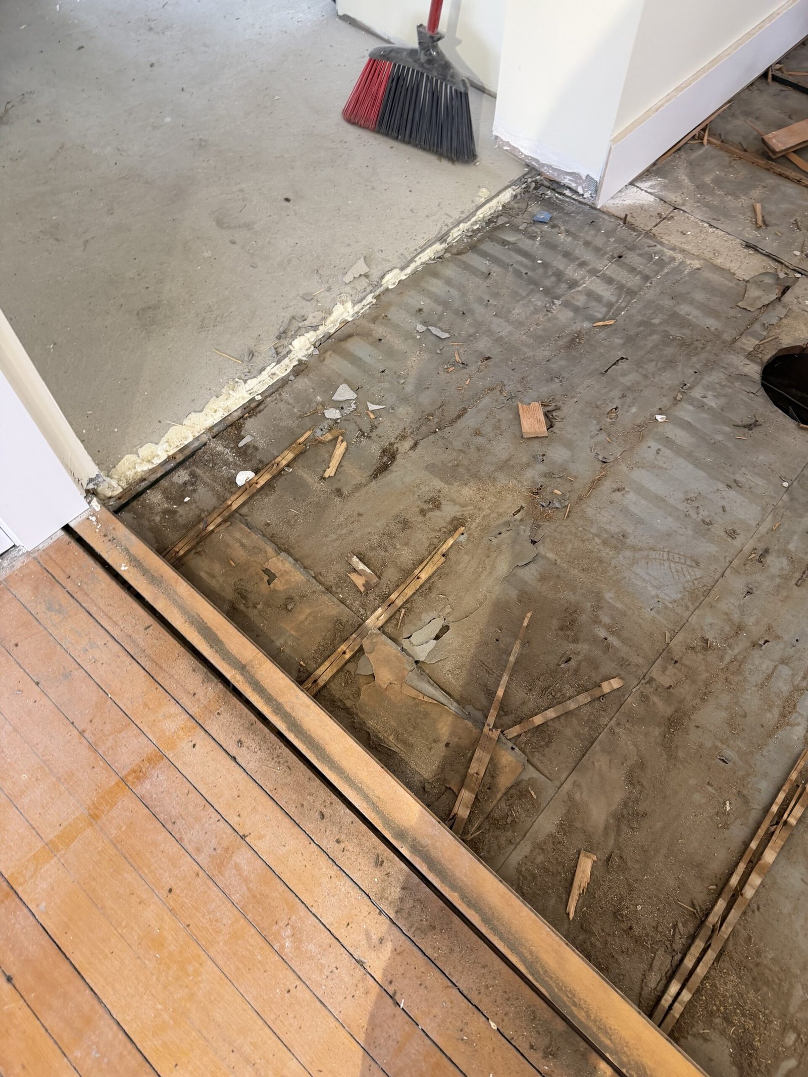 Old flooring removal and substrate preparation during whole-house renovation in Wayland Massachusetts, photograph 3