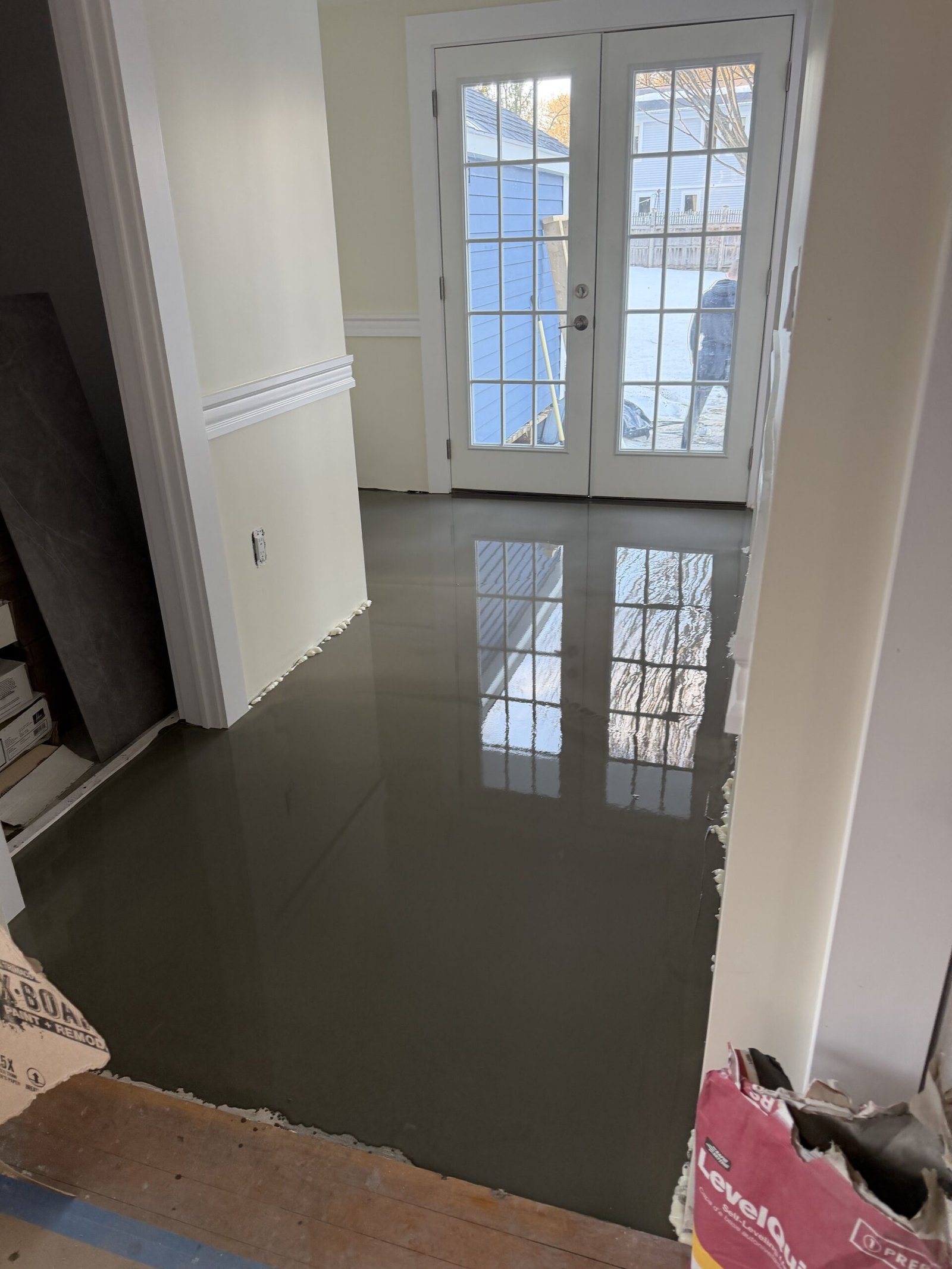 Self-leveling compound and final floor preparation during whole-house renovation in Wayland Massachusetts, photograph 12