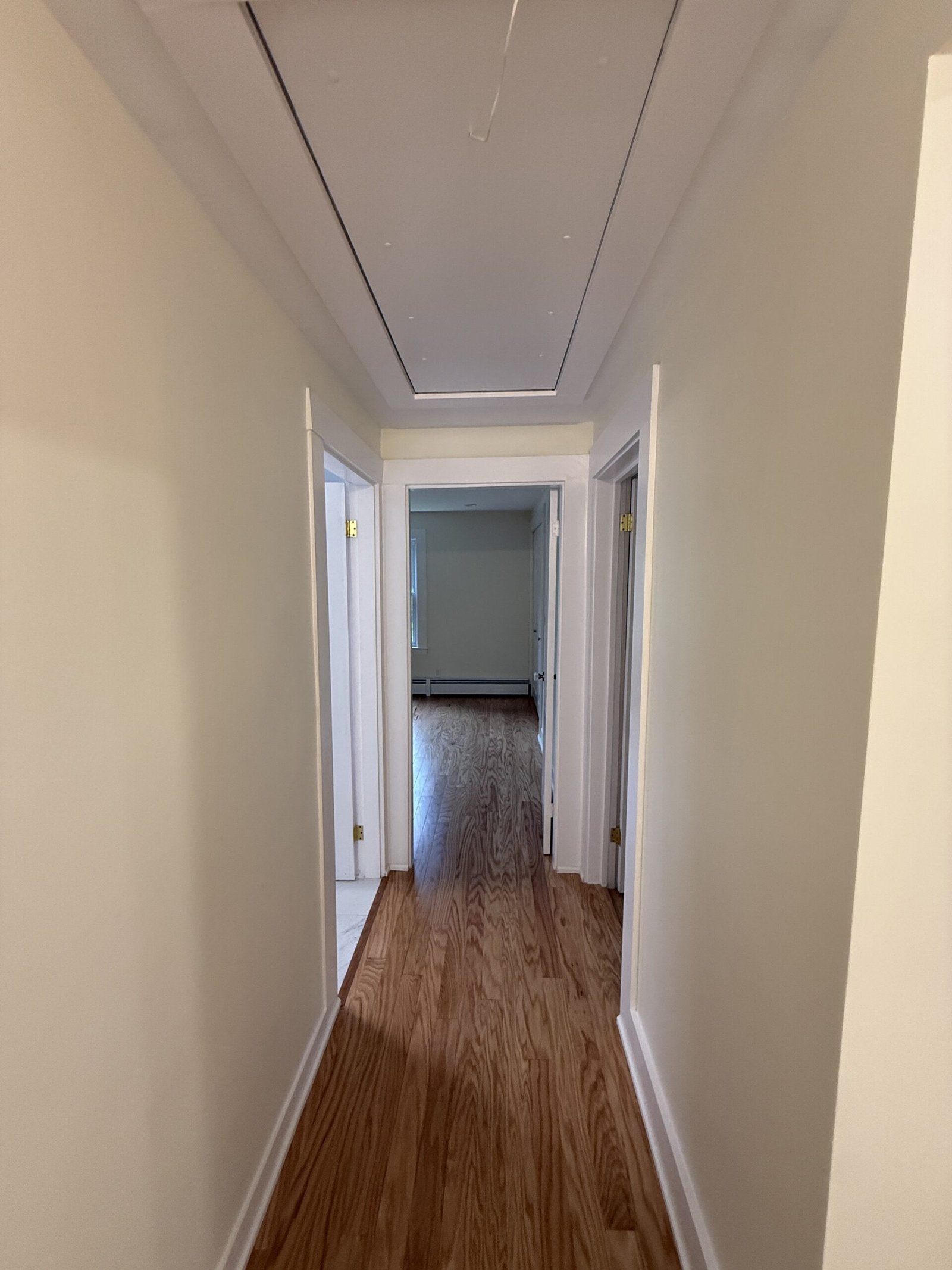 Completed hallway or refinished stair area after whole-house renovation in Wayland Massachusetts, photograph 1
