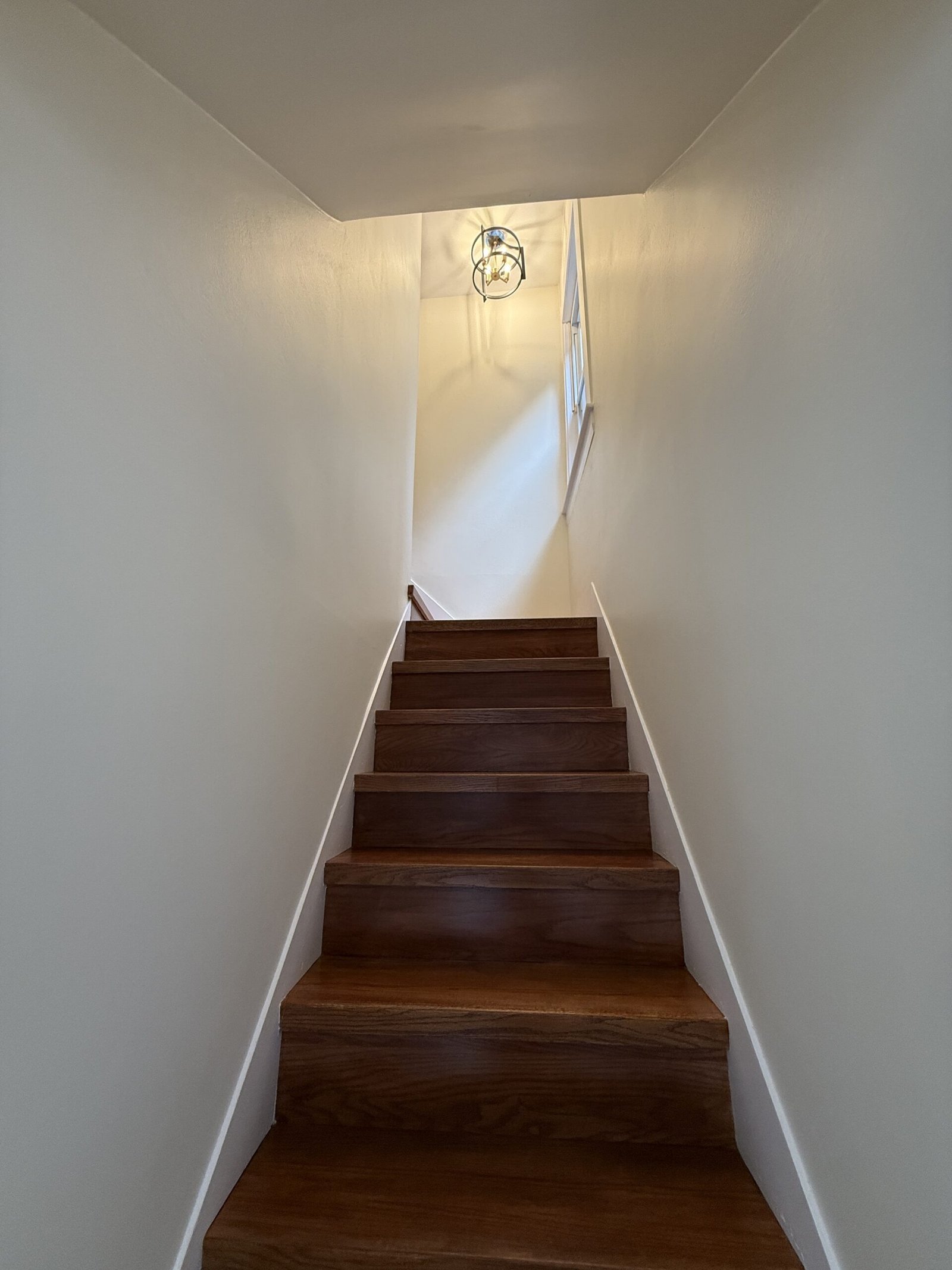 Completed hallway or refinished stair area after whole-house renovation in Wayland Massachusetts, photograph 3