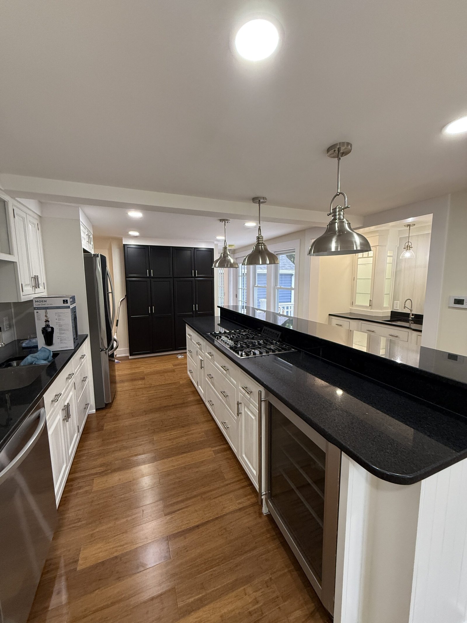 Finished kitchen and connected living space after a whole-house renovation in Wayland Massachusetts