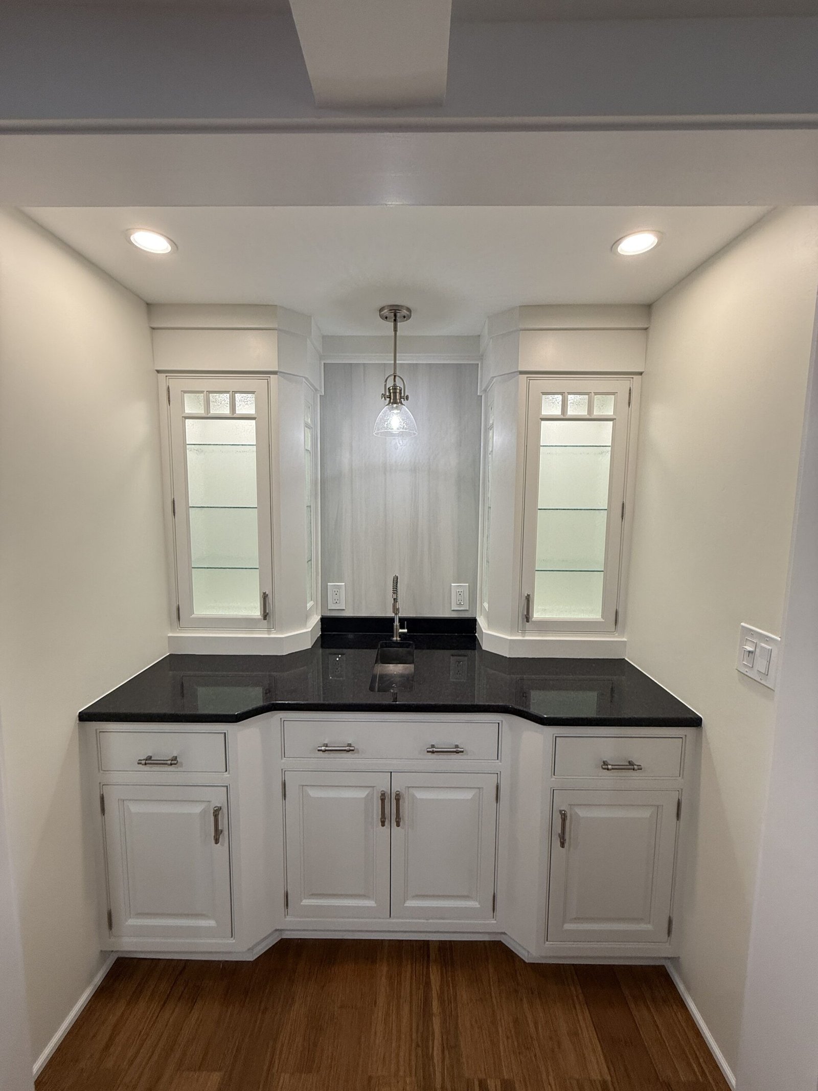 Contractor-taken completed kitchen, built-in, or connected living space after renovation in Wayland Massachusetts, photograph 2