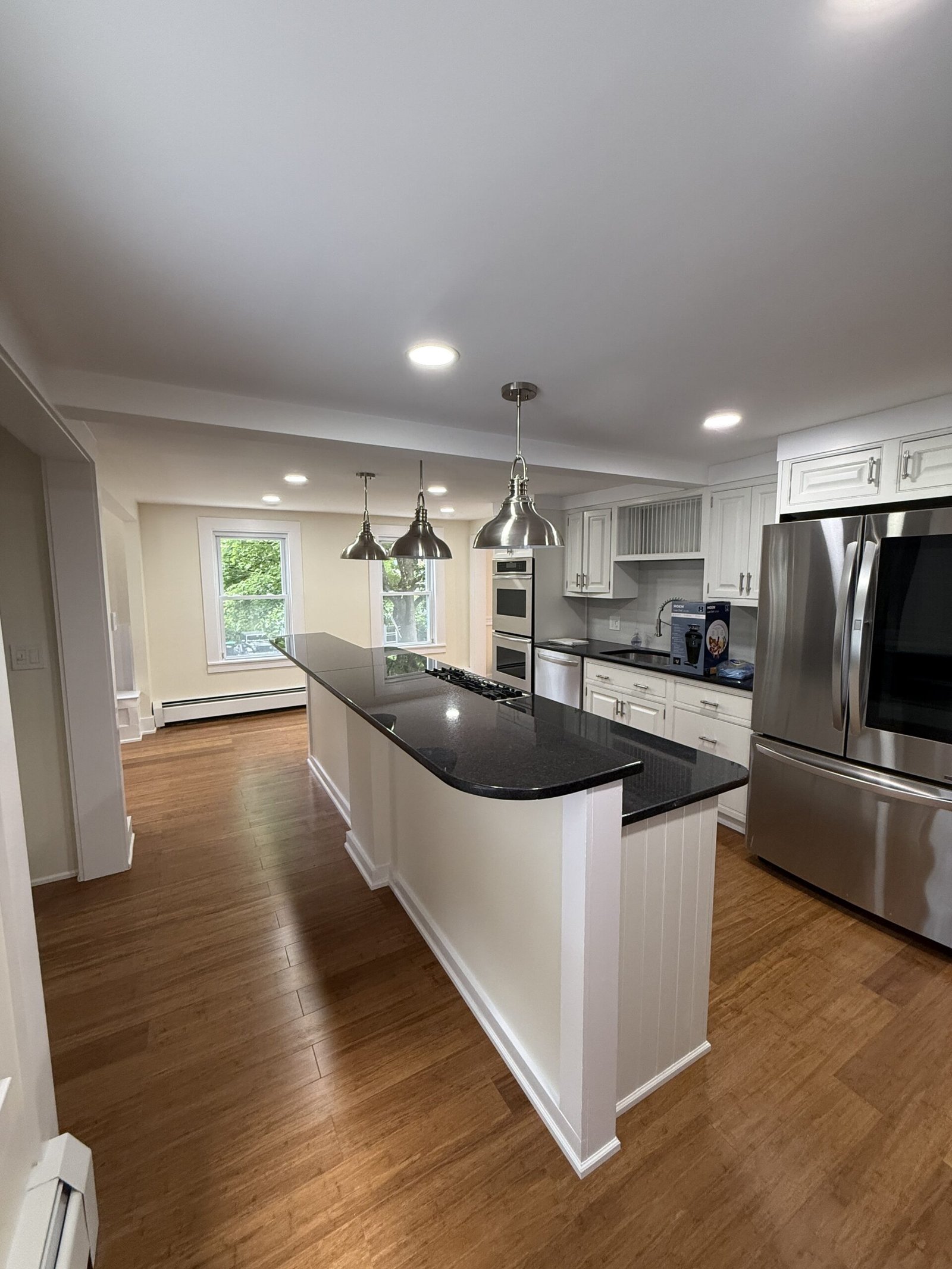 Contractor-taken completed kitchen, built-in, or connected living space after renovation in Wayland Massachusetts, photograph 3