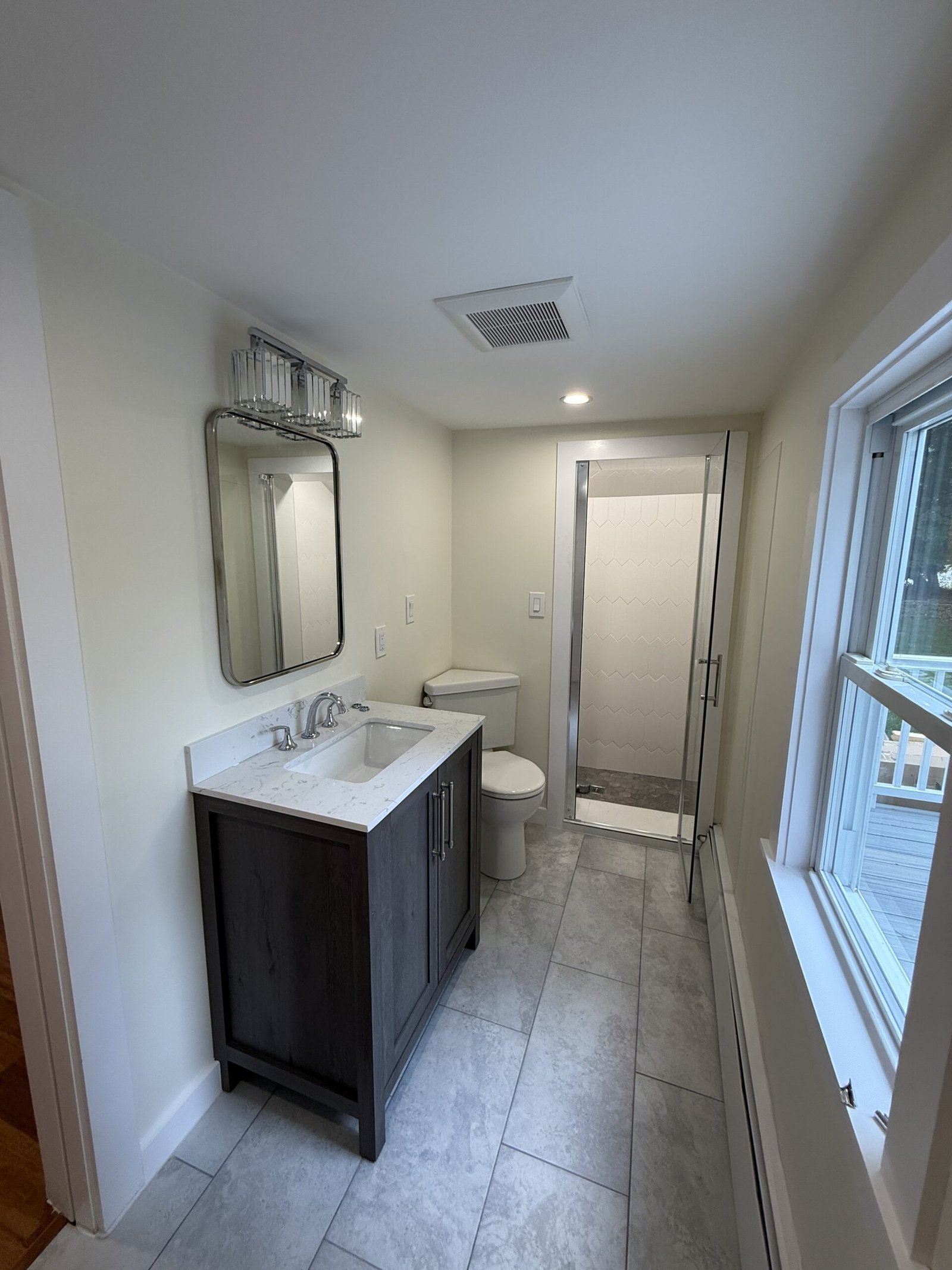 Contractor-taken completed bathroom after whole-house renovation in Wayland Massachusetts, photograph 7