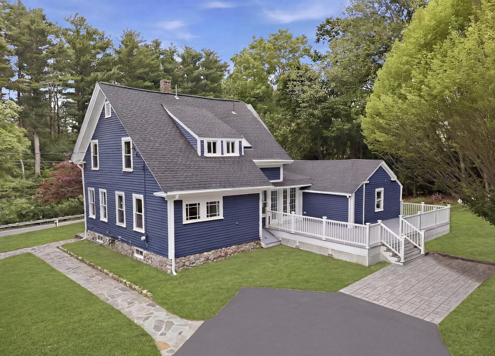 Professionally staged exterior final reveal after whole-house renovation in Wayland Massachusetts