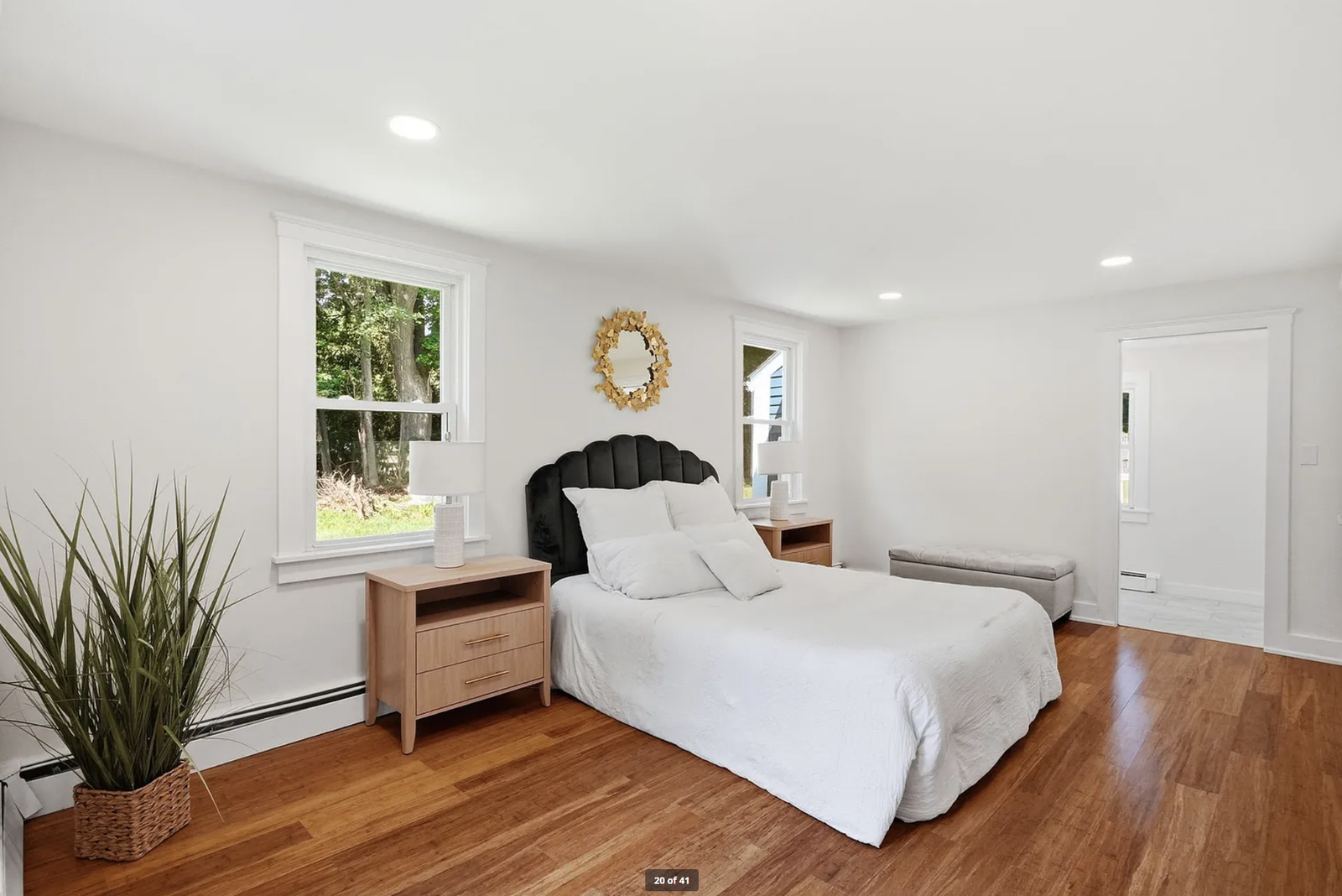 Professionally staged bedroom and upper-floor room after renovation in Wayland Massachusetts — view 1