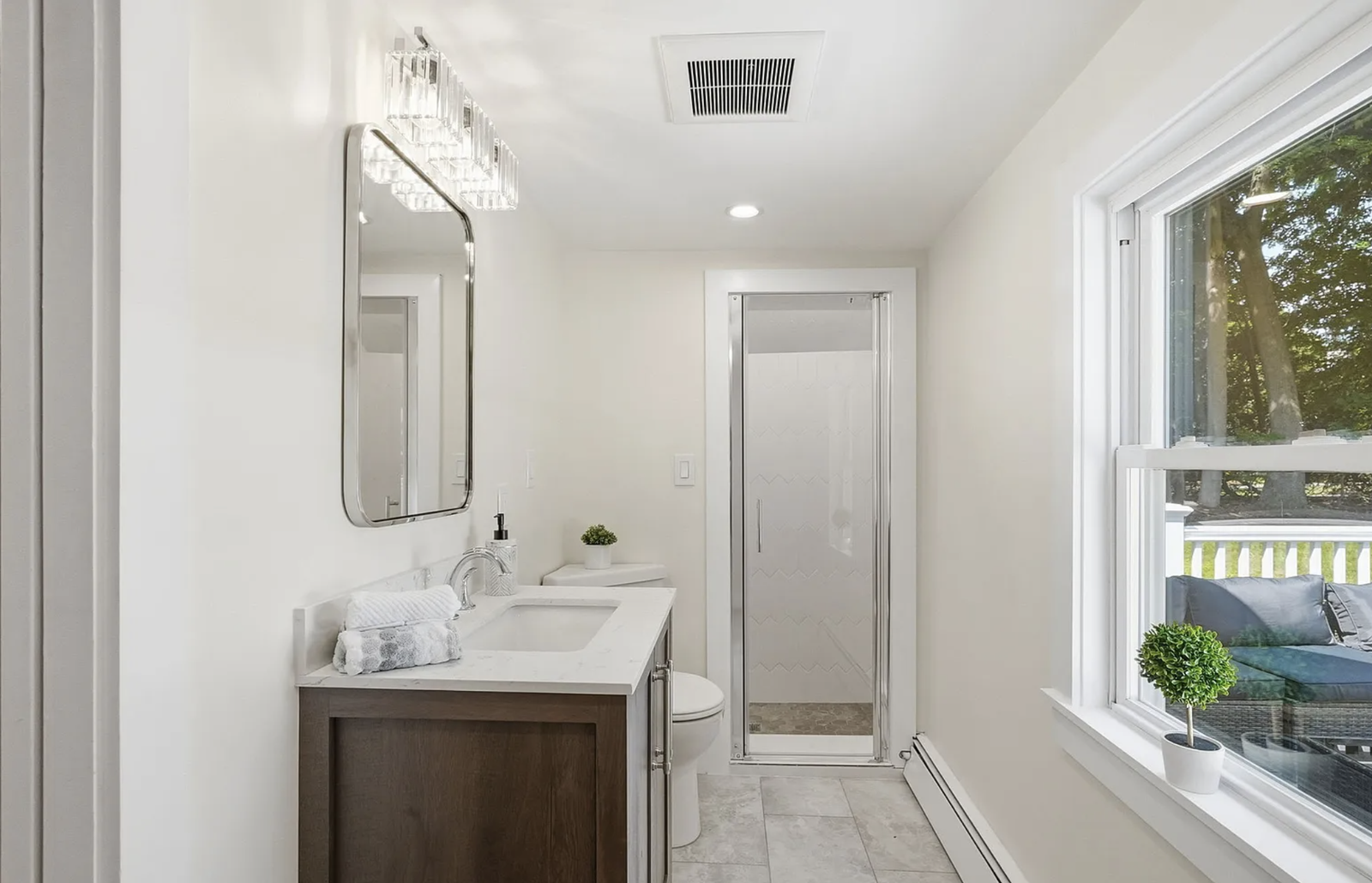 Professionally staged finished bathroom after whole-house renovation in Wayland Massachusetts — view 2